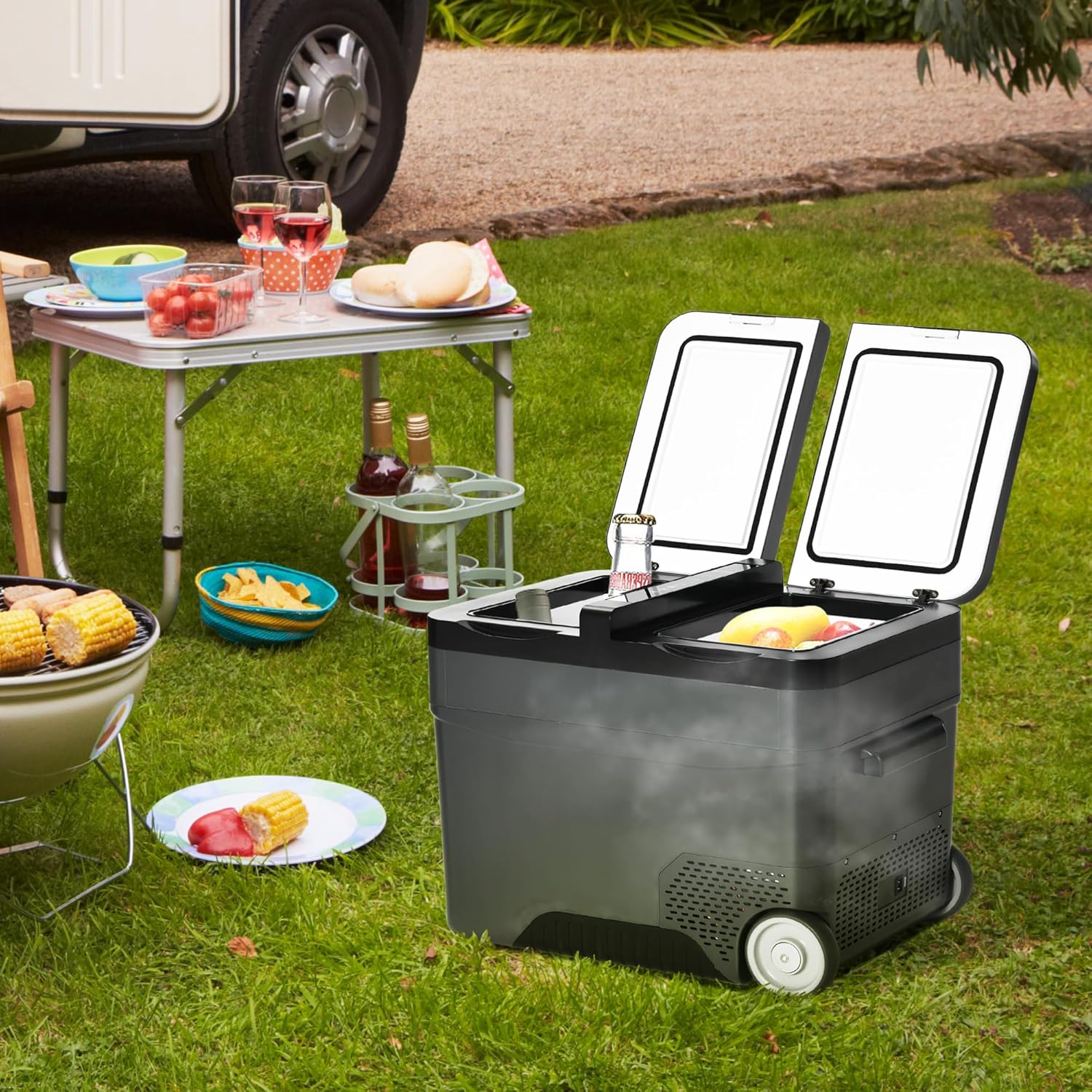 Outsunny Portable Electric Compressor Refrigerator 35L in an outdoor setting next to a camping table.