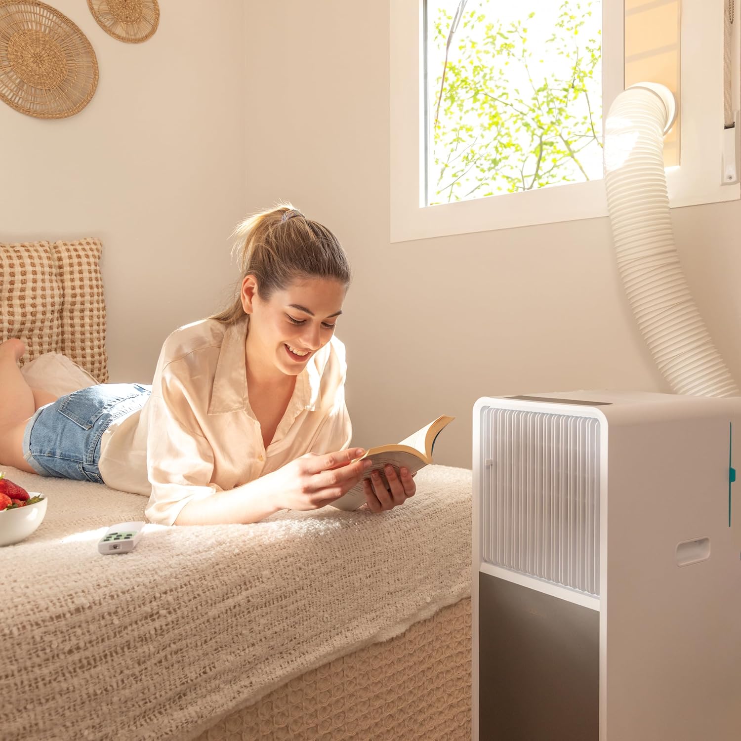 Person demonstrating the portability of the Cecotec ForceClima 9150 Style Portable Air Conditioner using its multi-directional wheels