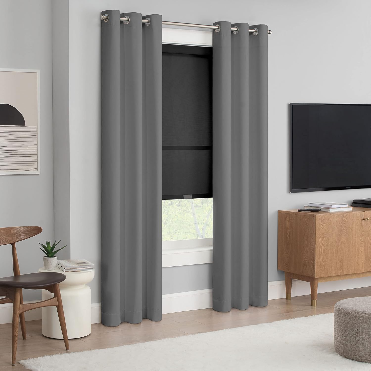 Eclipse Roller Shade in a room with curtains, demonstrating its light filtering.