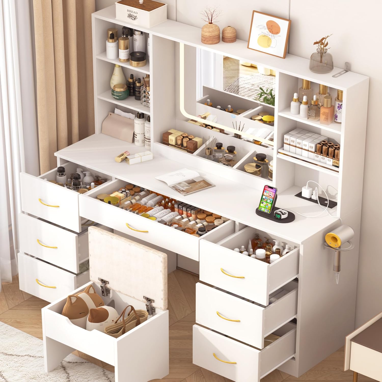 chartustriable vanity desk with all drawers and stool storage compartment open, filled with cosmetics and accessories.