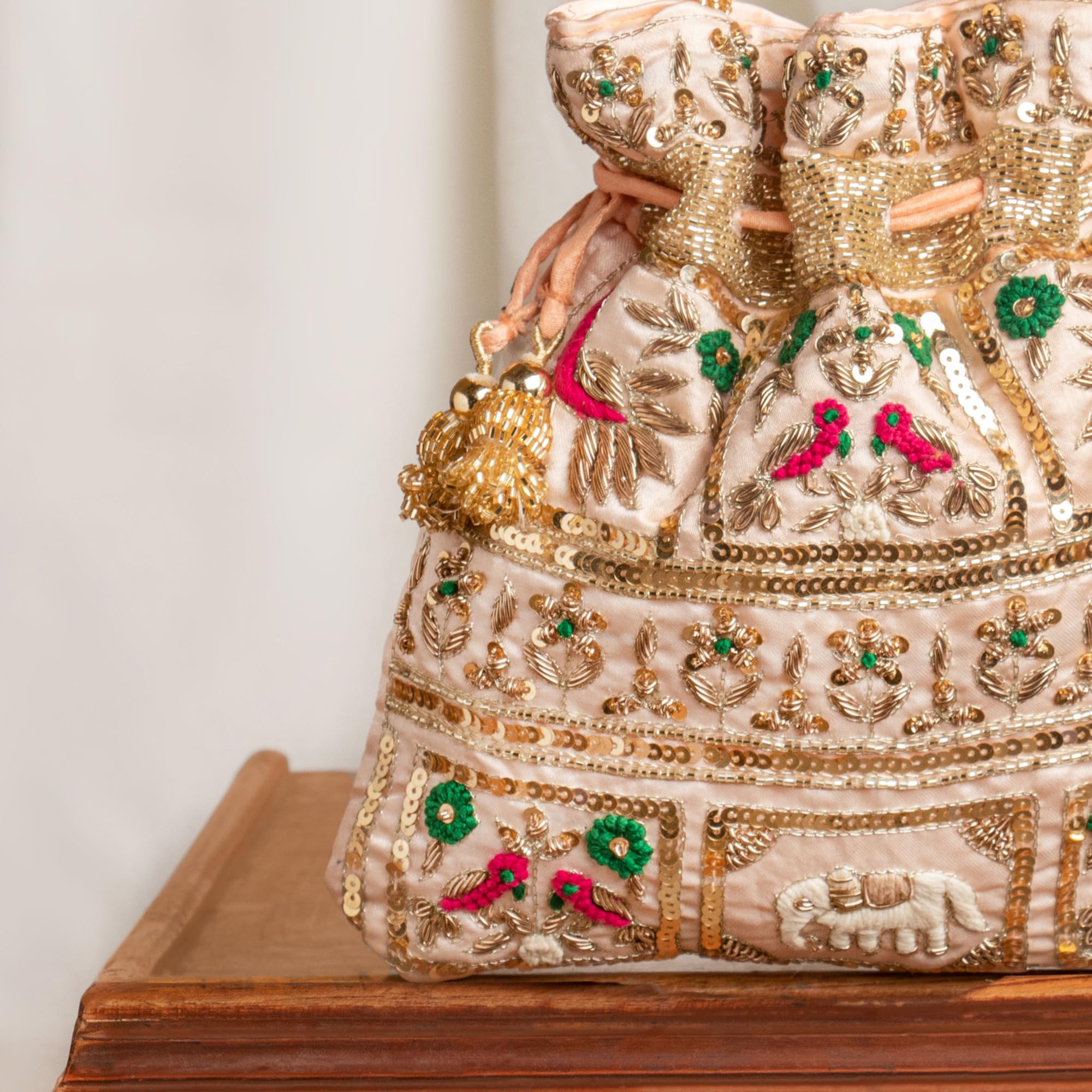 Amayra Luxe Handcrafted Embroidered Wedding Potli Bag with Elephant & Peacock Motifs β Drawstring Ethnic Purse for Women (Gold & Multicolor) 1
