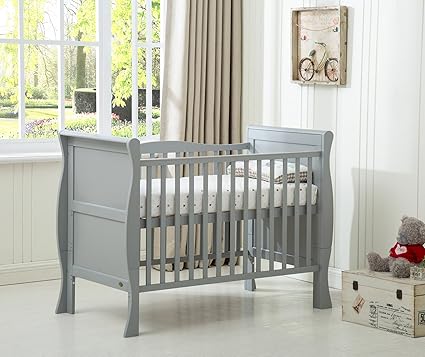 grey cot with mattress