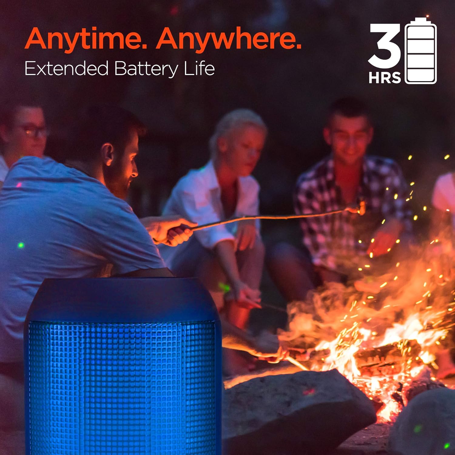 HyperGear RaveMini speaker glowing blue at a campfire, indicating extended battery life