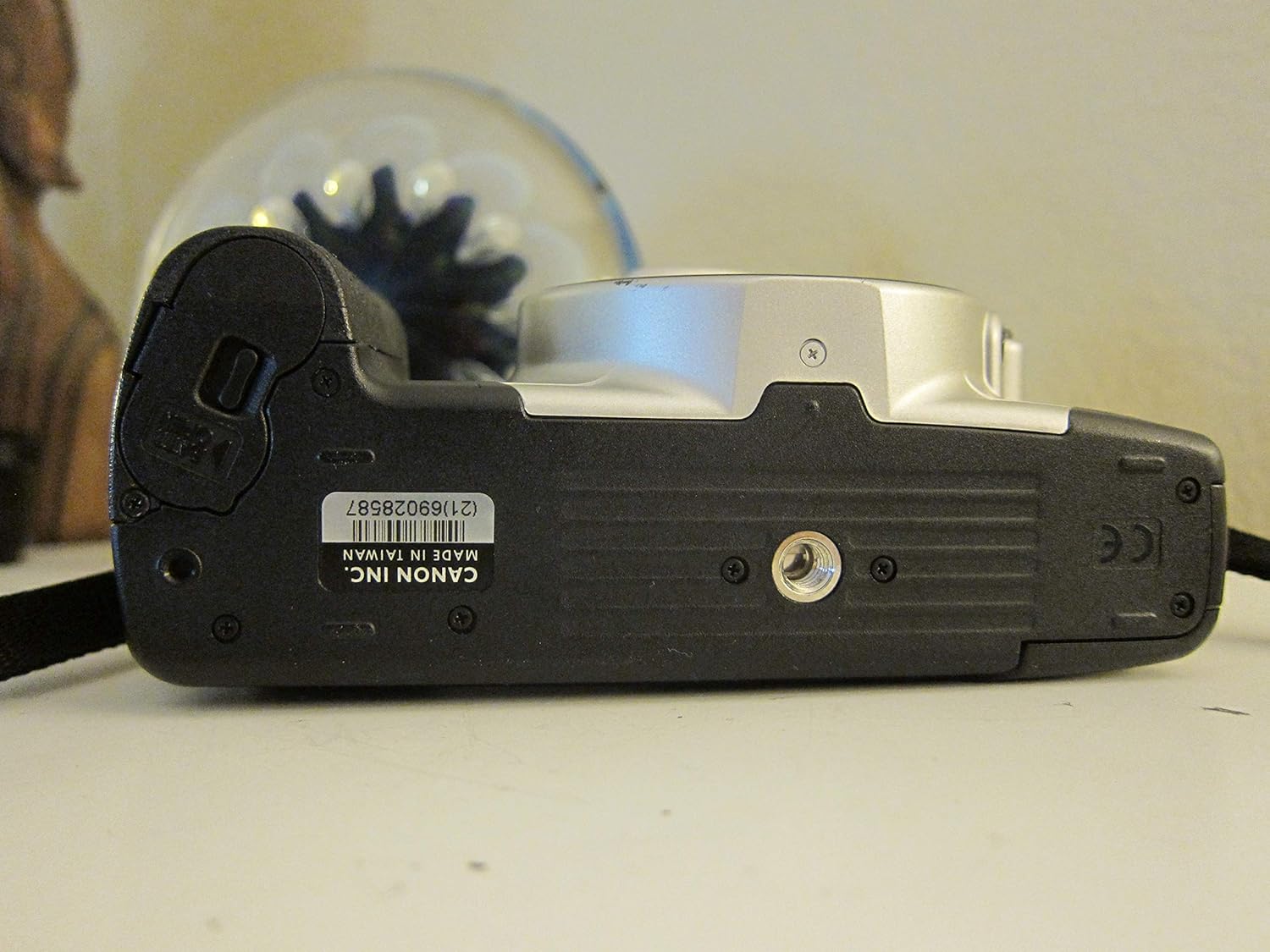 Oke view of the Canon Rebel 2000 camera, showing the mode dial, shutter button, and LCD screen.