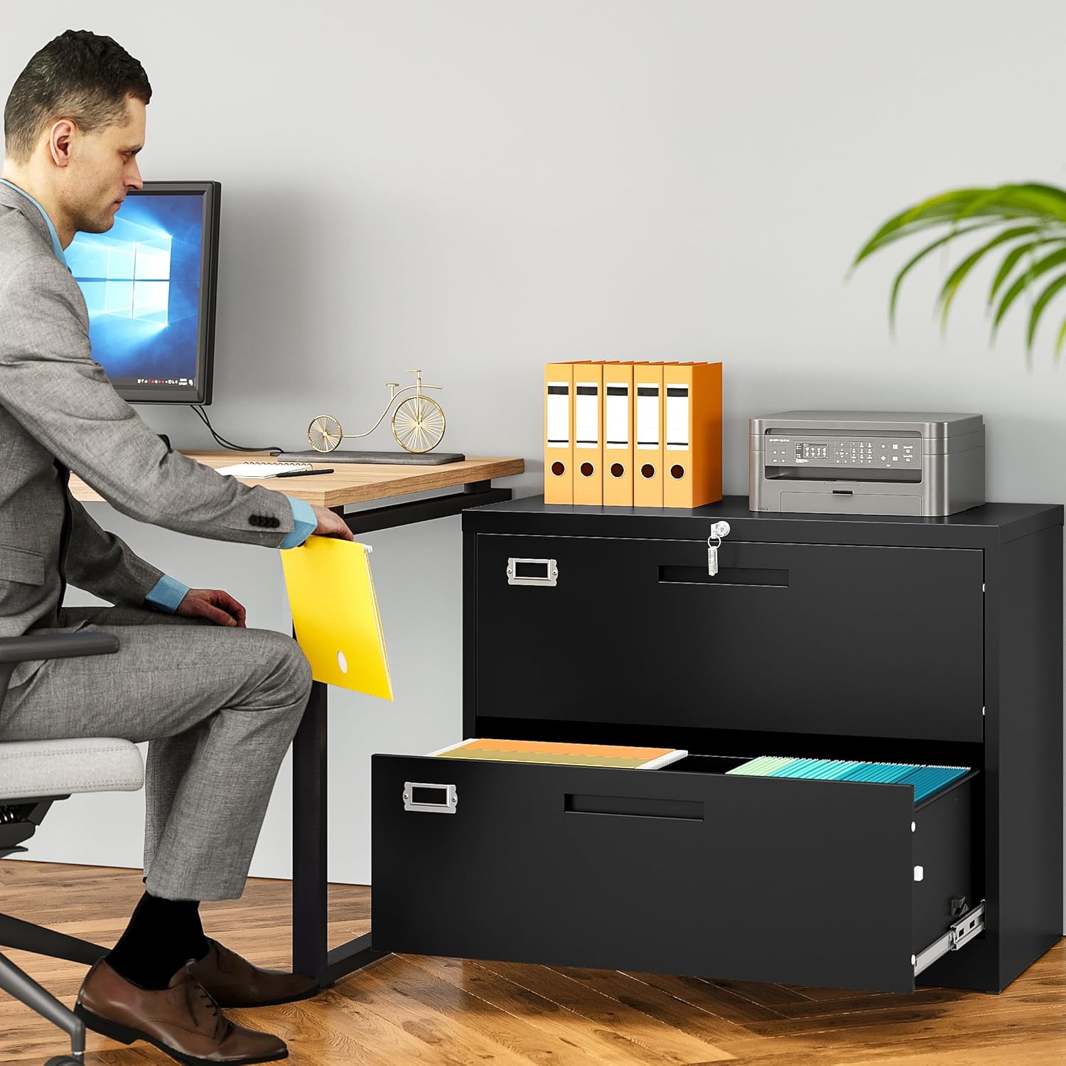 Man using the SISESOL 2 Drawer Lateral File Kabine