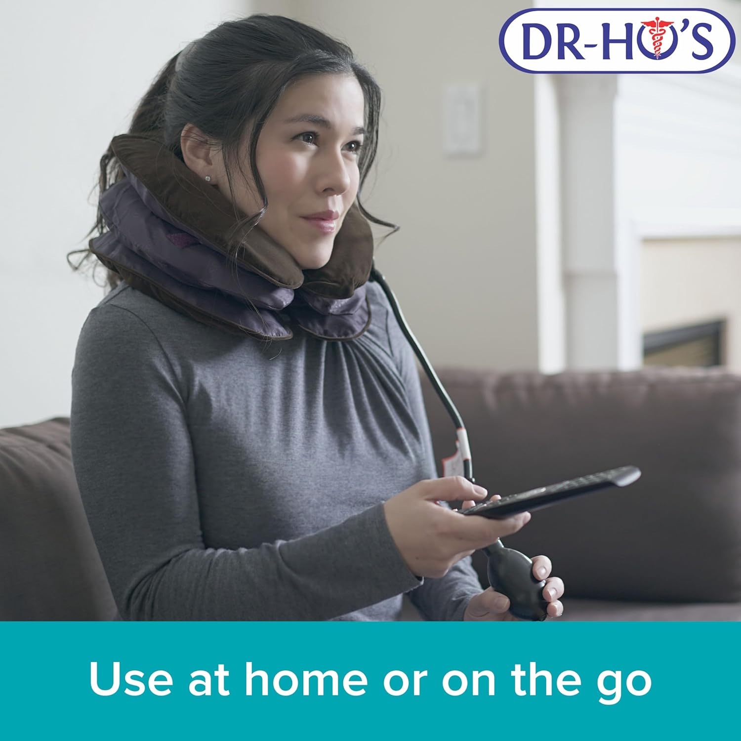 Woman using Dr-Ho's Neck Comforter on a couch