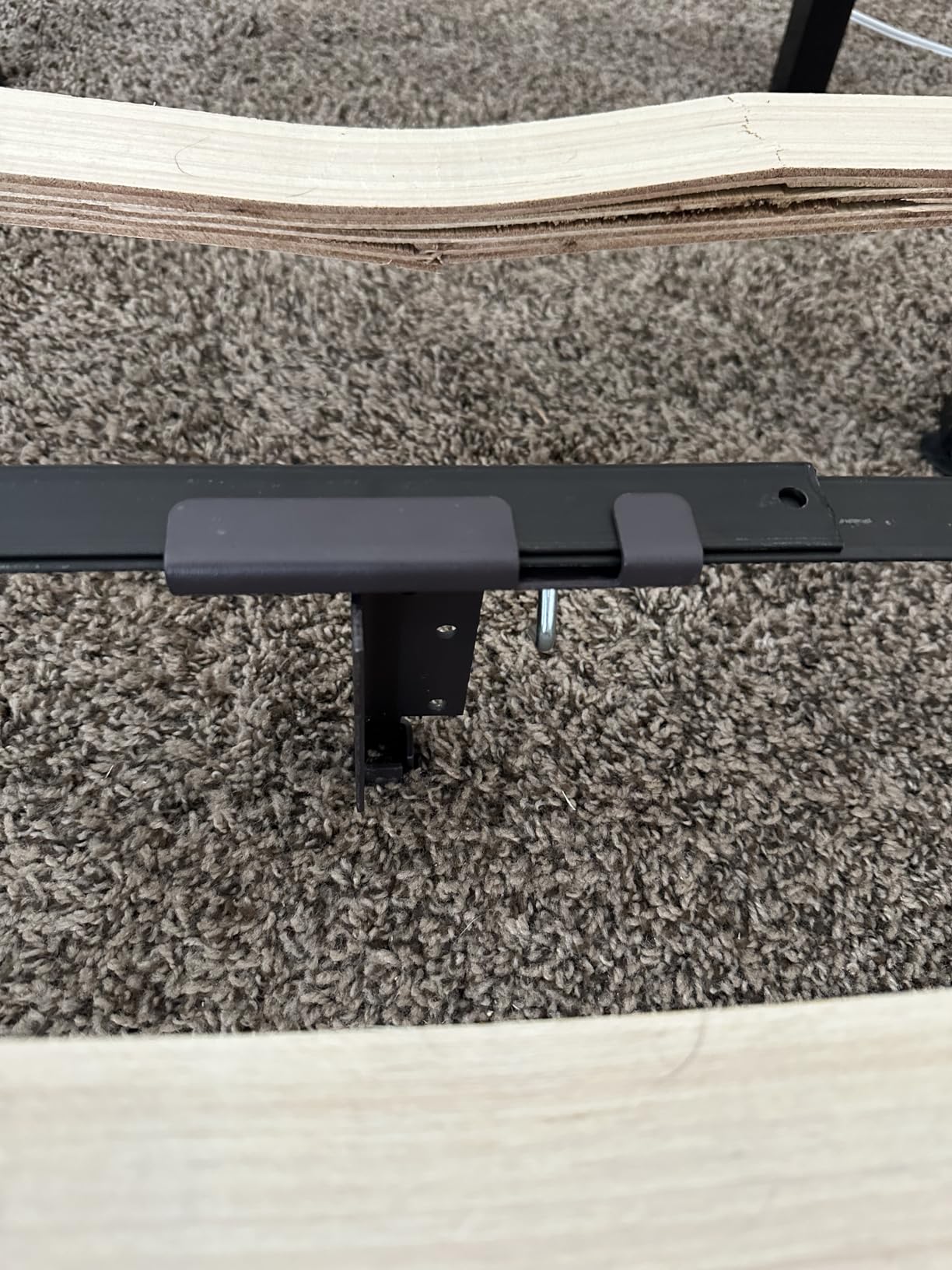 Close-up of bed support leg adjustment