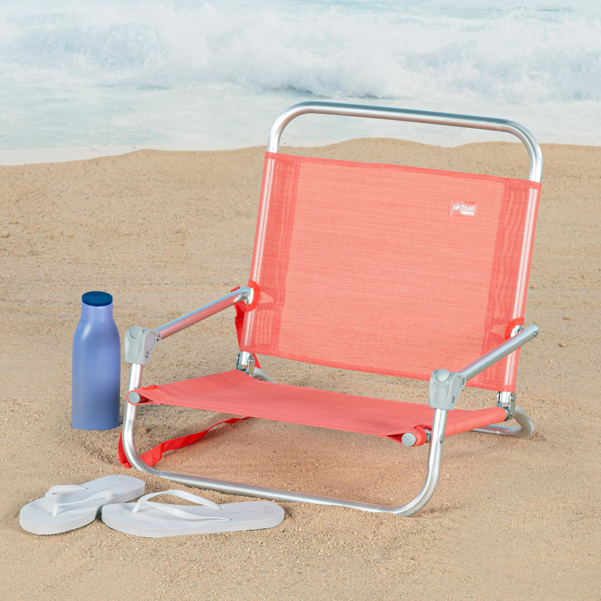 Aktive 62676 Silla plegable playa, acampada, Asiento bajo, Sin tubo delantero, Soporta 110 kg, Asa hombro de transporte, Estructura aluminio, 46 x 44 x 49 cm, Coral