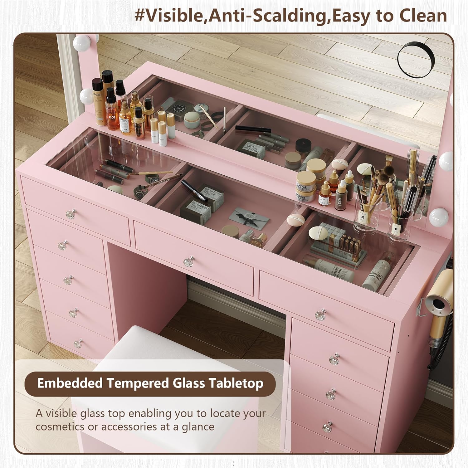 Close-up of the vanity's glass tabletop, showing organized cosmetics beneath the transparent surface