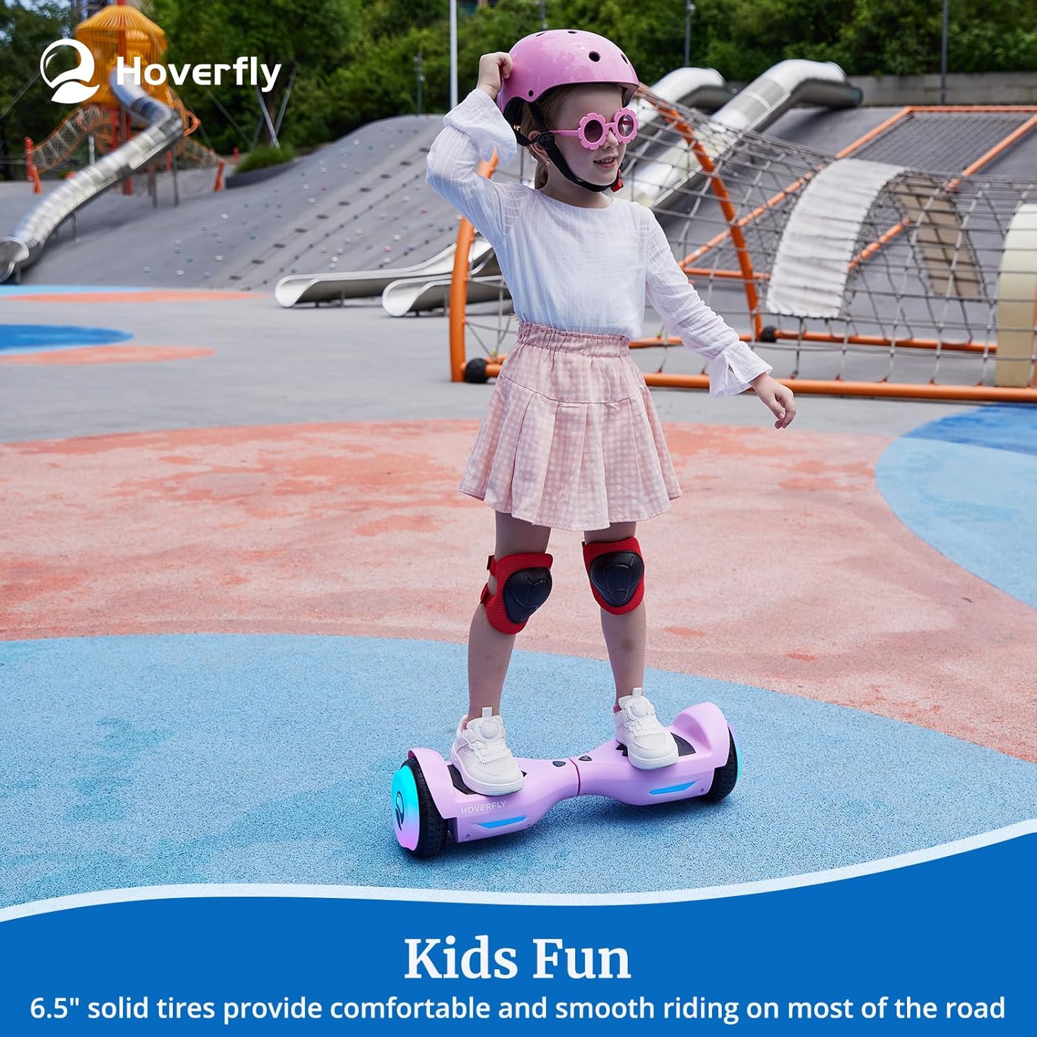 Child on HOVERFLY Elf Hoverboard wearing a helmet and knee pads