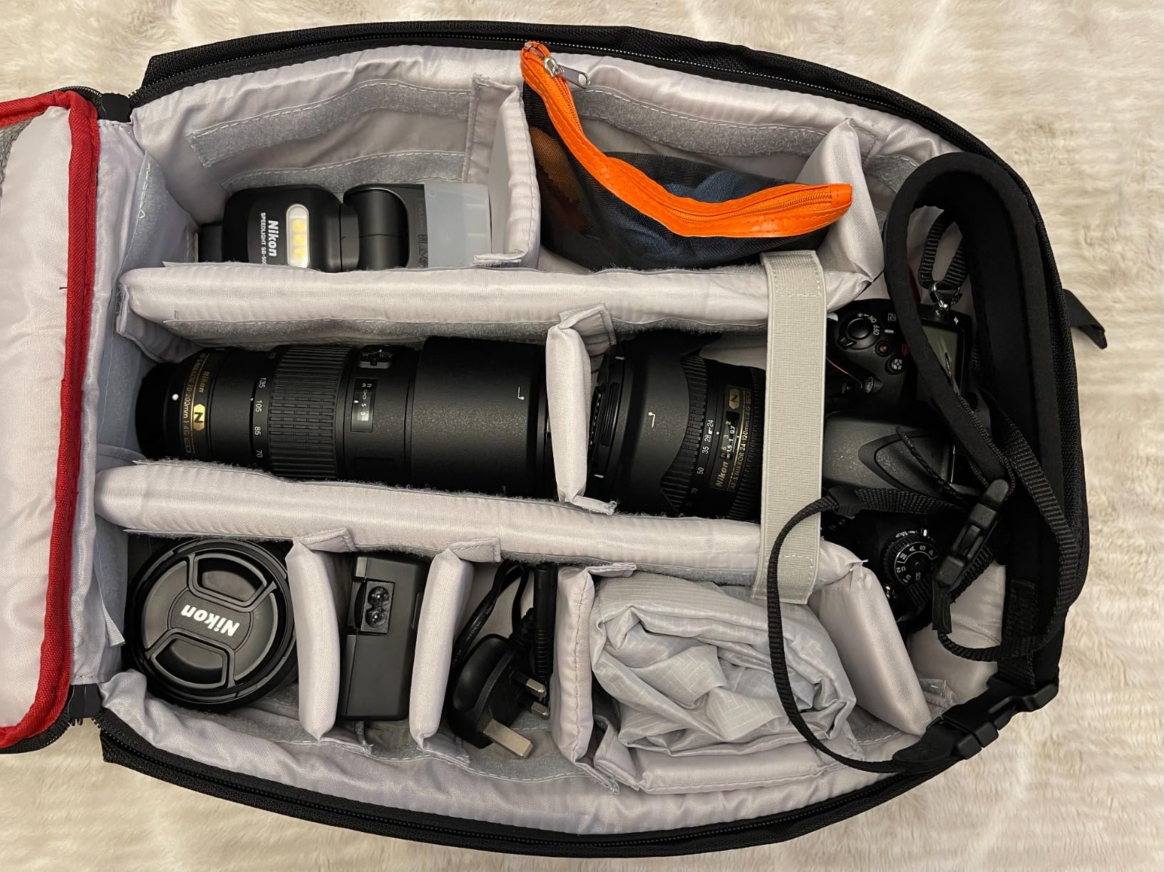 Decent size backpack for a DSLR with several lens and flash