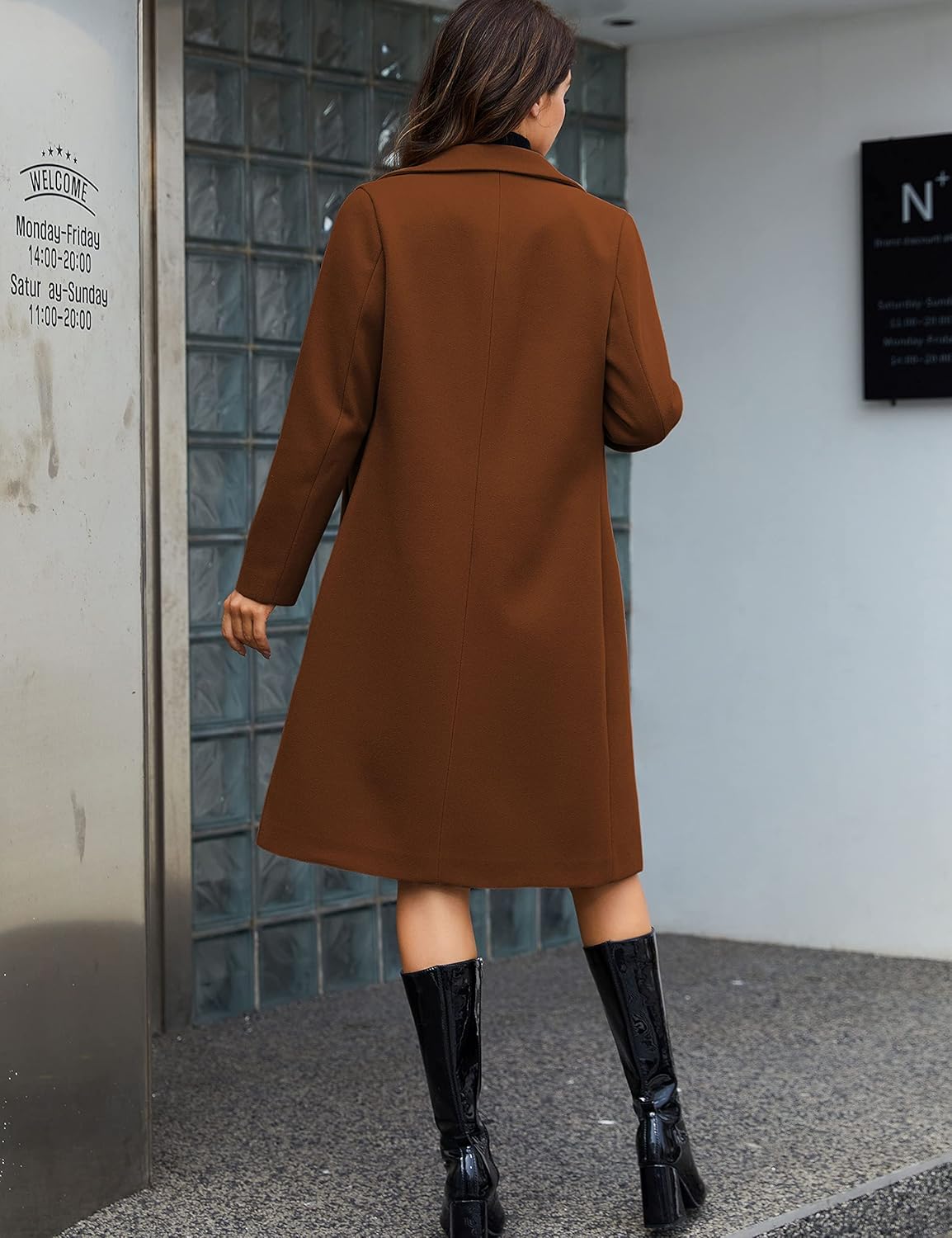 Elegantly Styled for Autumn: A Back View of a Woman in a Rich Brown Coat