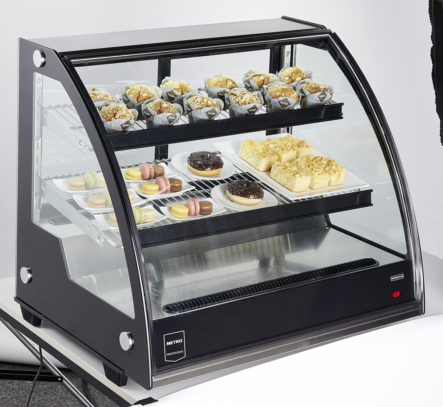 METRO Professional GCV1600 display case filled with various pastries and desserts, showcasing product presentation.