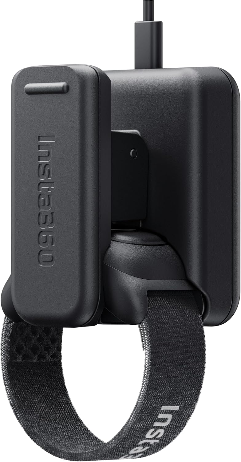 Insta360 GO Ultra Ring Remote connected to its charging dock