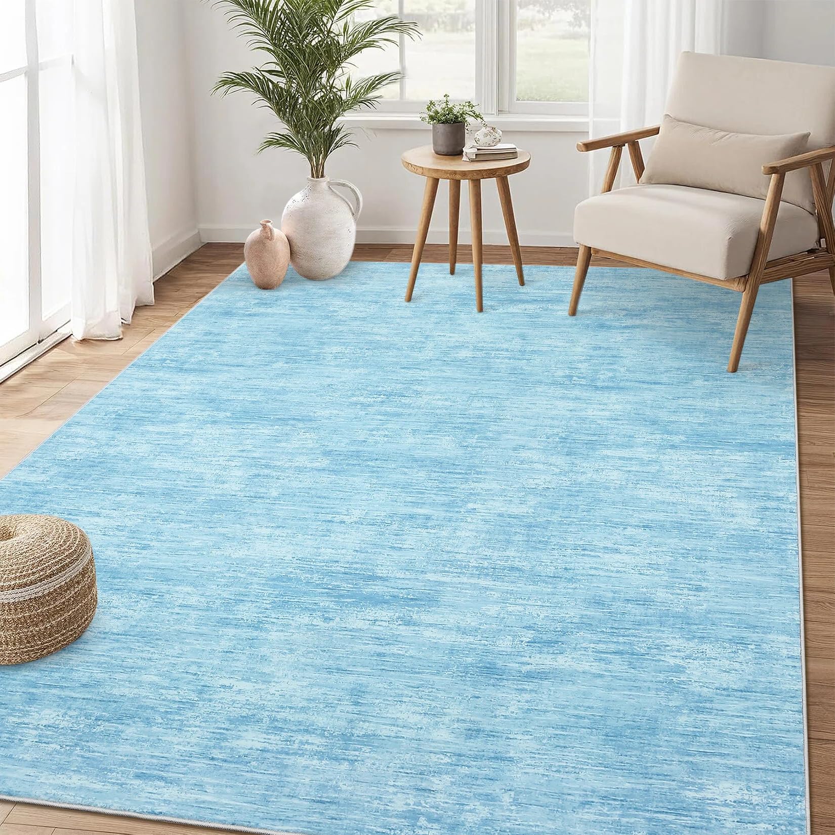 Tapis de salon moderne bleu texturé pour réchauffer l'ambiance de votre bureau