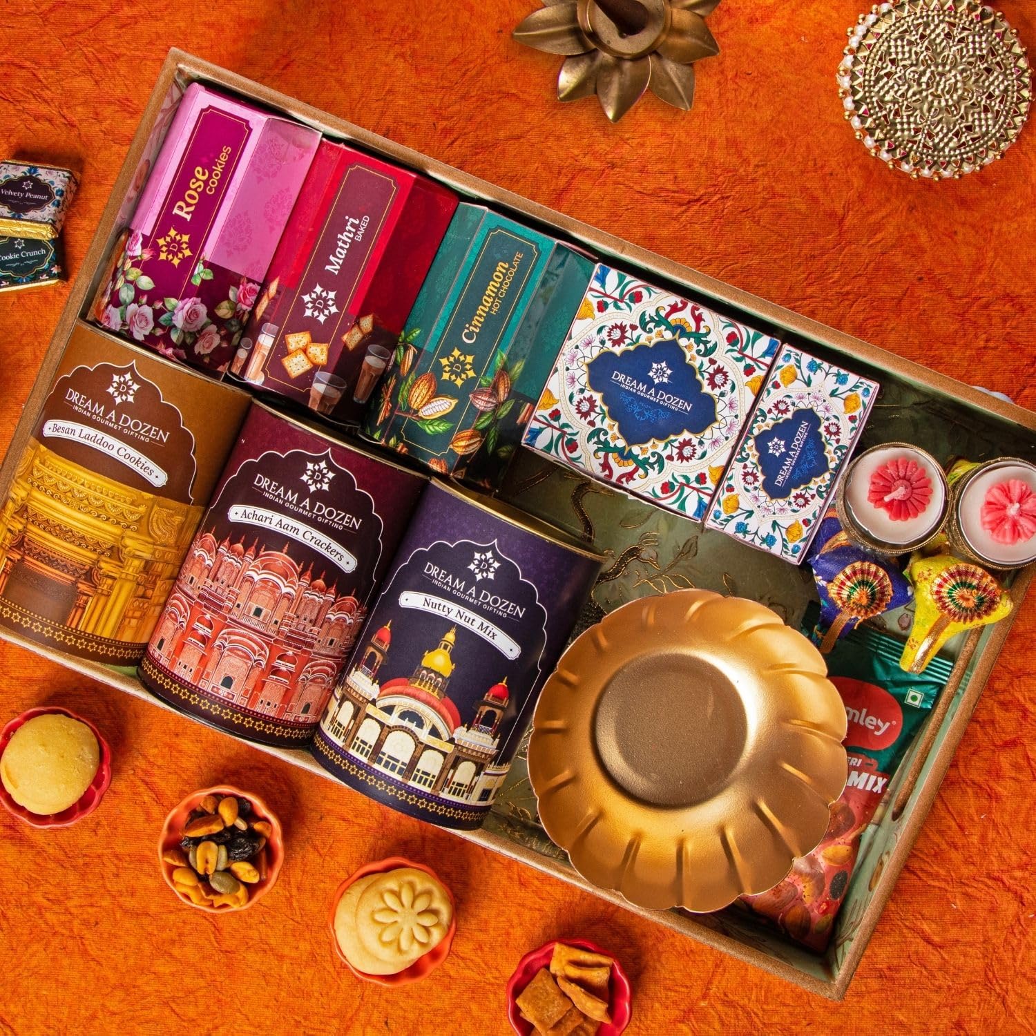 Dream a Dozen Emerald Paradise Gift Hamper | Premium Diwali Gift Tray 10x16 Inch with Nutty Nut Mix, Achari Aam Crackers, Rose Cookies, Mathri Crackers, Besan Laddoo Cookies, Cinnamon Hot Chocolate Mix, Indian Gourmet Chocolates, Elephant Tealight Holders, Lotus Bowl, Tote Bag, Festive Candles & Greeting Card | Luxury Indian Festive & Corporate Gift Box-image-29