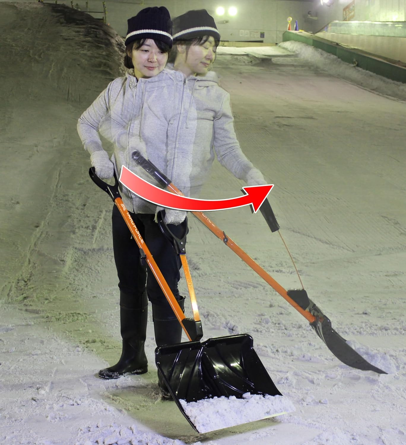 Woman demonstrating the lever action of the YARD FORCE Snow Shovel to throw snow
