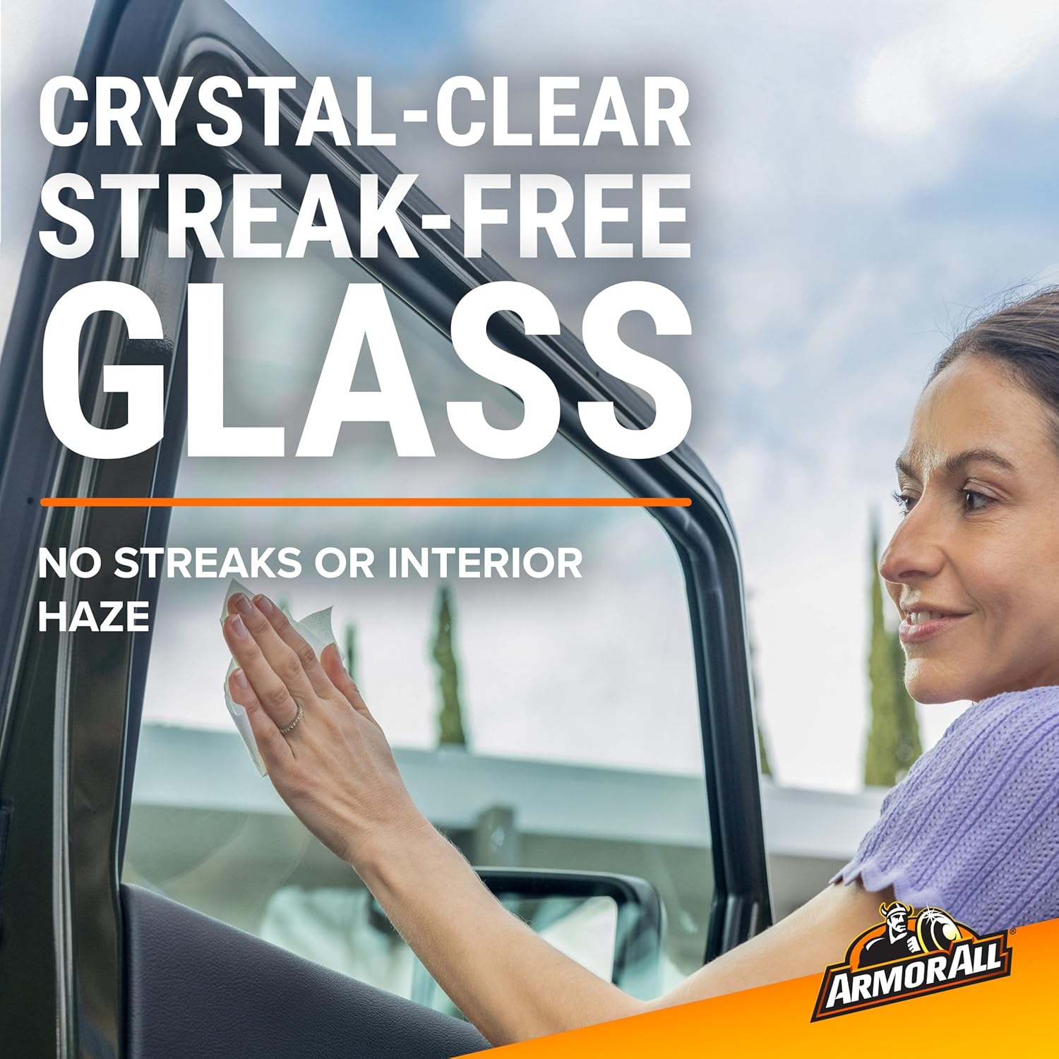 Woman wiping car window with a glass wipe