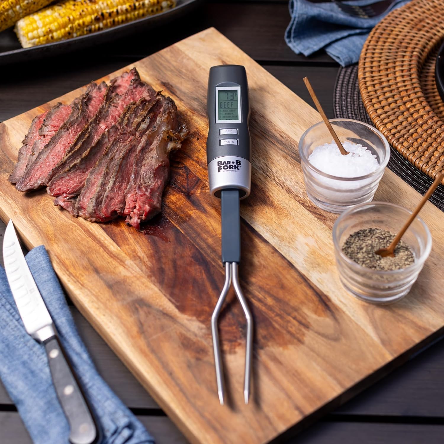Cooked meat on a cutting board with Maverick BarBFork