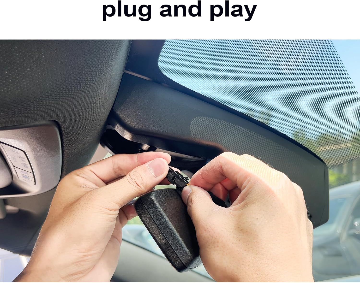 Hands connecting a plug to the dash cam for installation