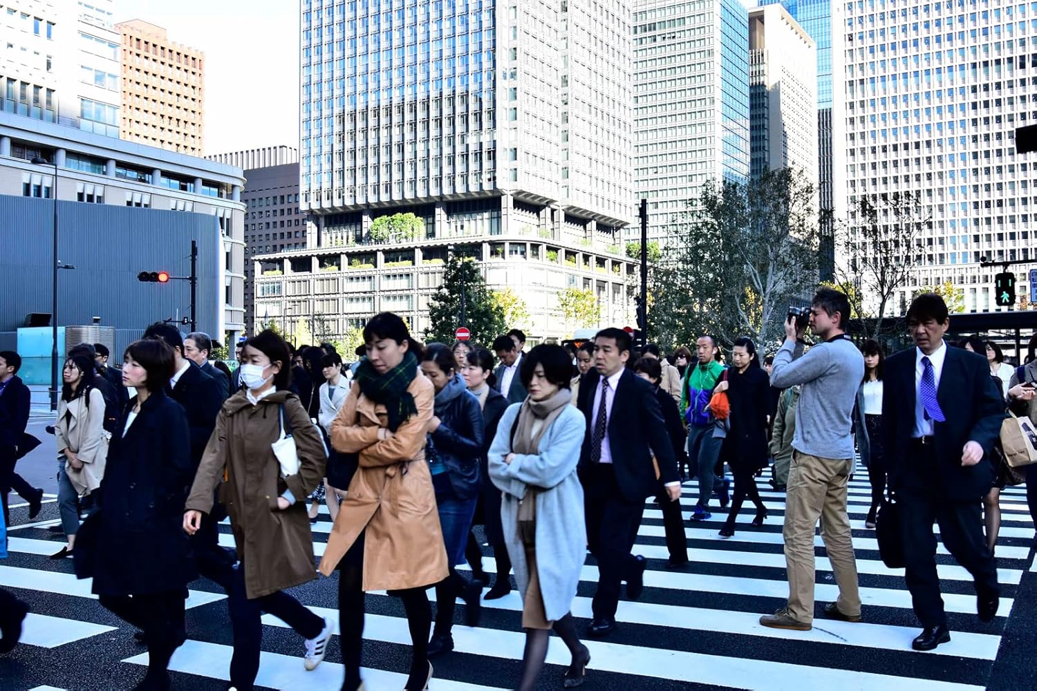 Busy city street with people walking, captured without an ND filter