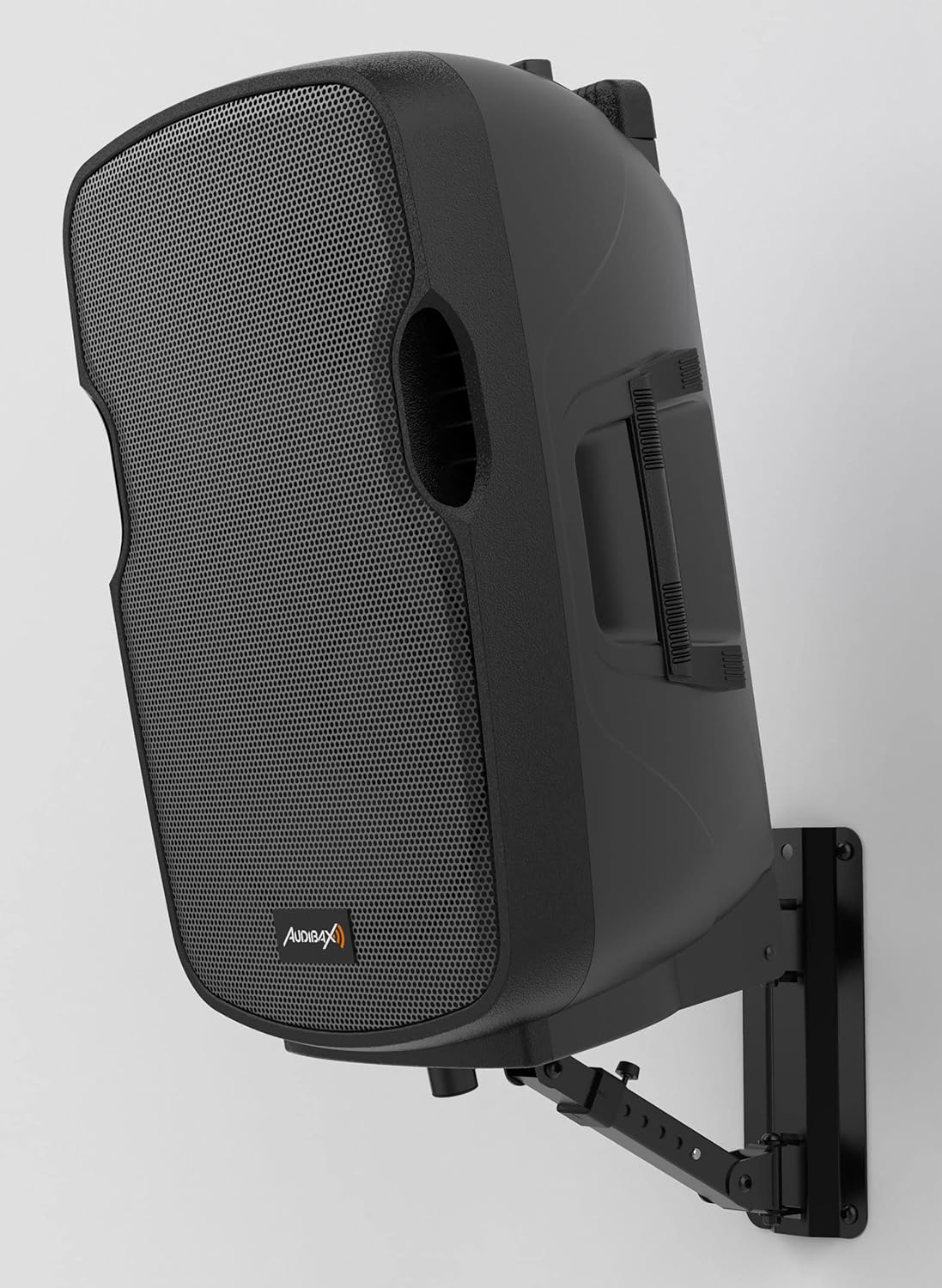 A professional speaker securely mounted on the Audibax Neo 30 wall mount, installed on a white wall.