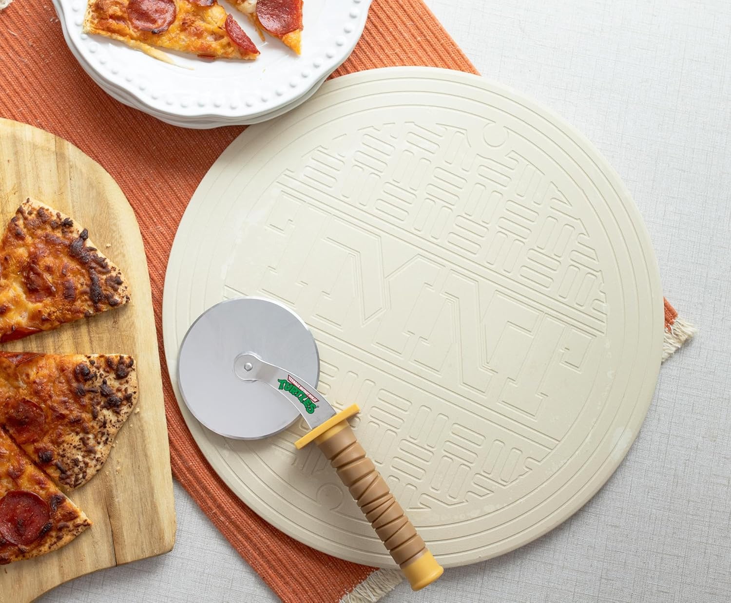 Teenage Mutant Ninja Turtles Pizza Cutter and Baking Stone Set | Deluxe Cookware For Oven and Grill