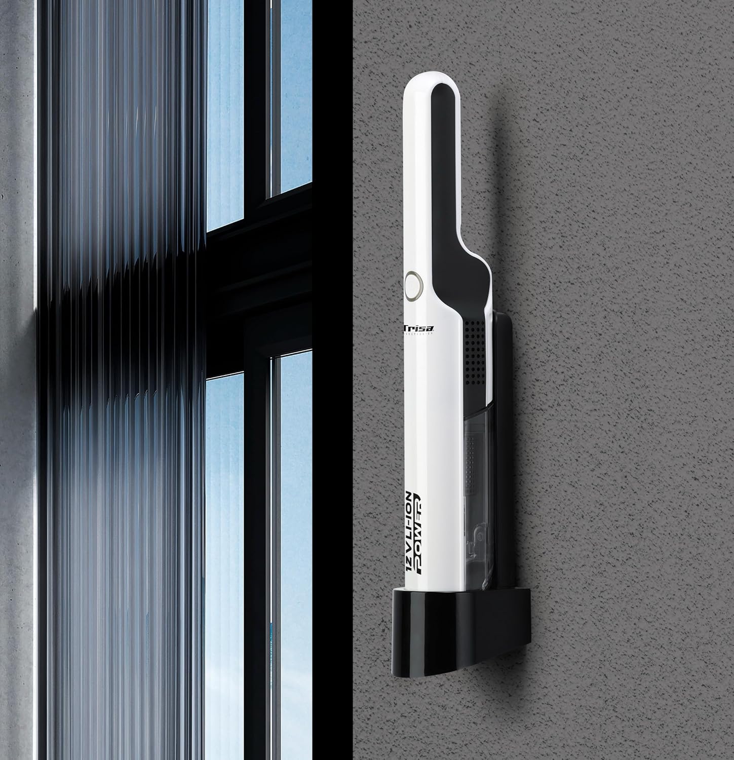 Trisa T0070 handheld vacuum cleaner mounted on a wall bracket