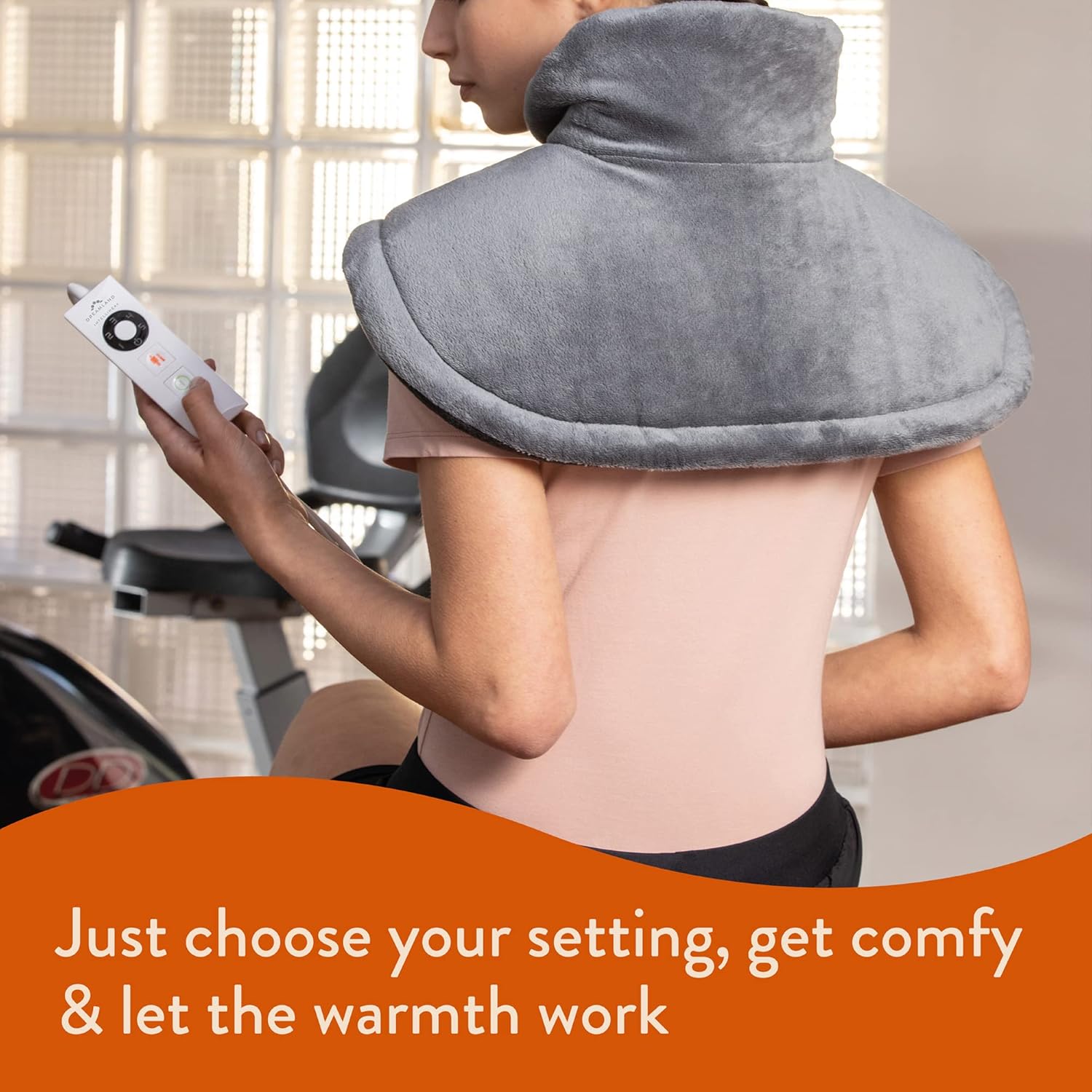 Woman using Dreamland Neck & Shoulders Heat Pad