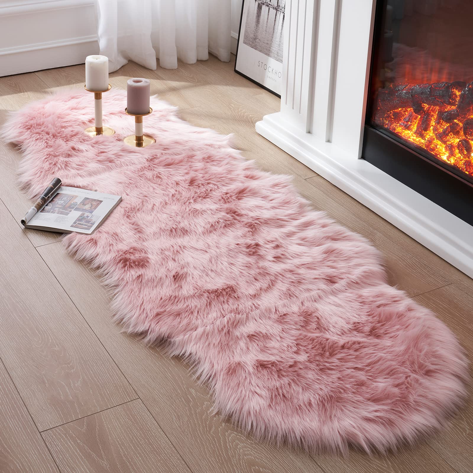 Photo 1 of Tangsoo Faux Fur Sheepskin Rug - Pink, 2x4 ft