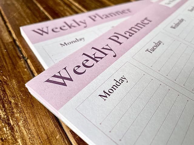 A4 Weekly Planner with Eye-catching Metallic Ink adds a Touch of Prestige to Your Desk. Days of The Week, Scheduler, Task Notes and to Do Lists Complete with 50 Tear-Off Sheets
