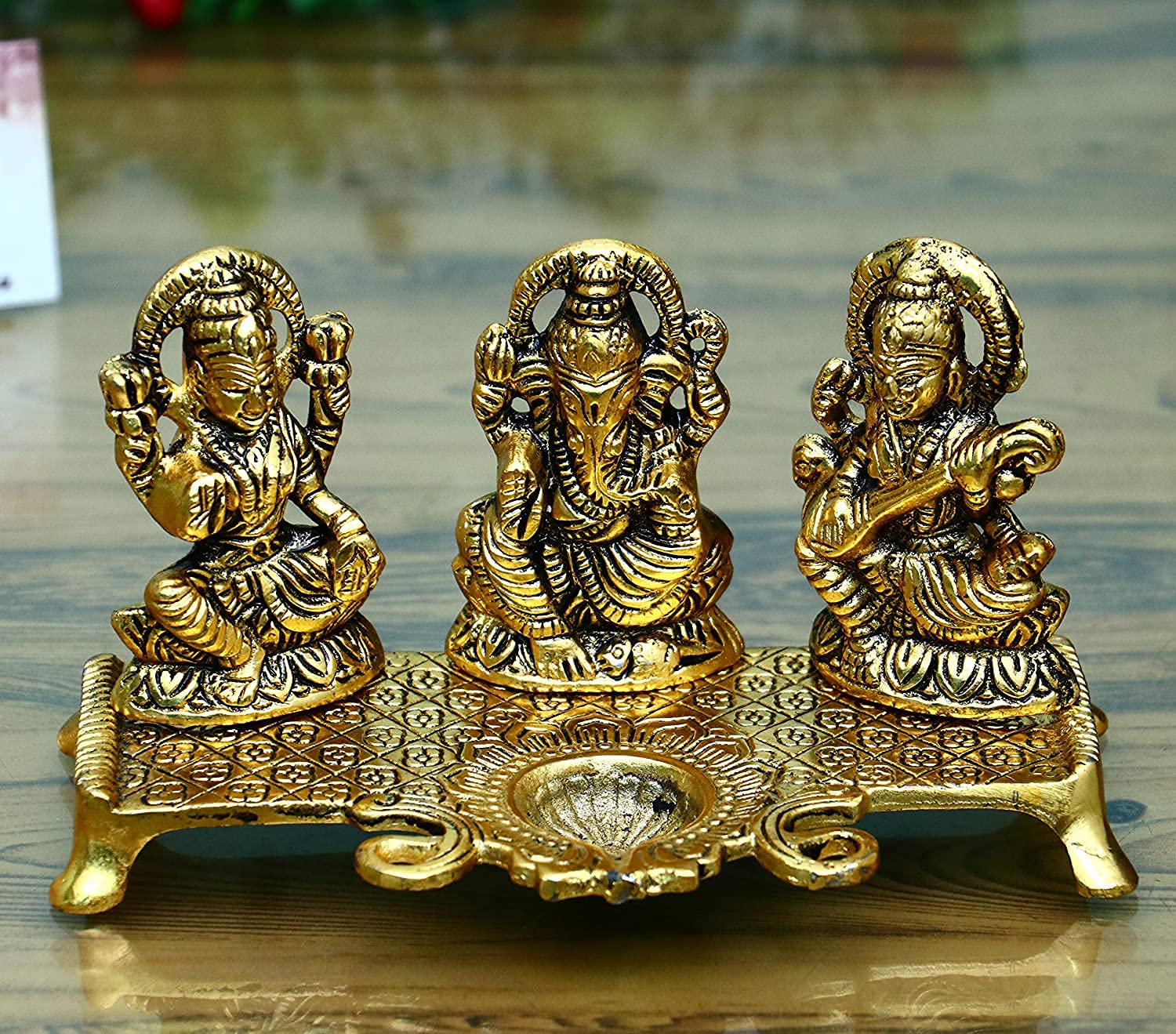 KRISHA KRAFTSLaxmi Ganesh Saraswati with Diya Decorative Showpiece - 19 cm (Metal, Gold)