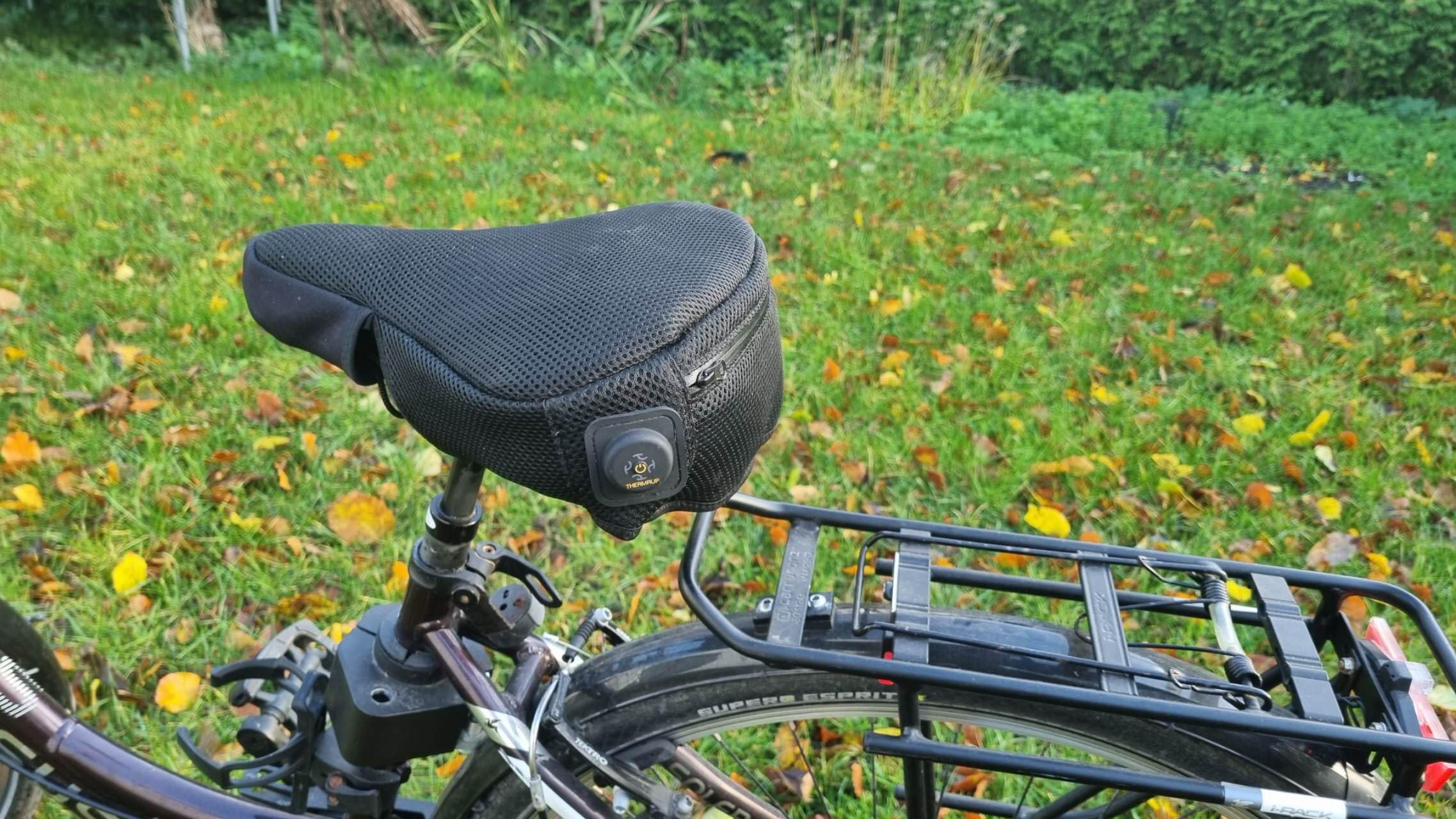 Thermrup Housse de selle de vélo chauffante USB avec sac de batterie externe et housse de pluie