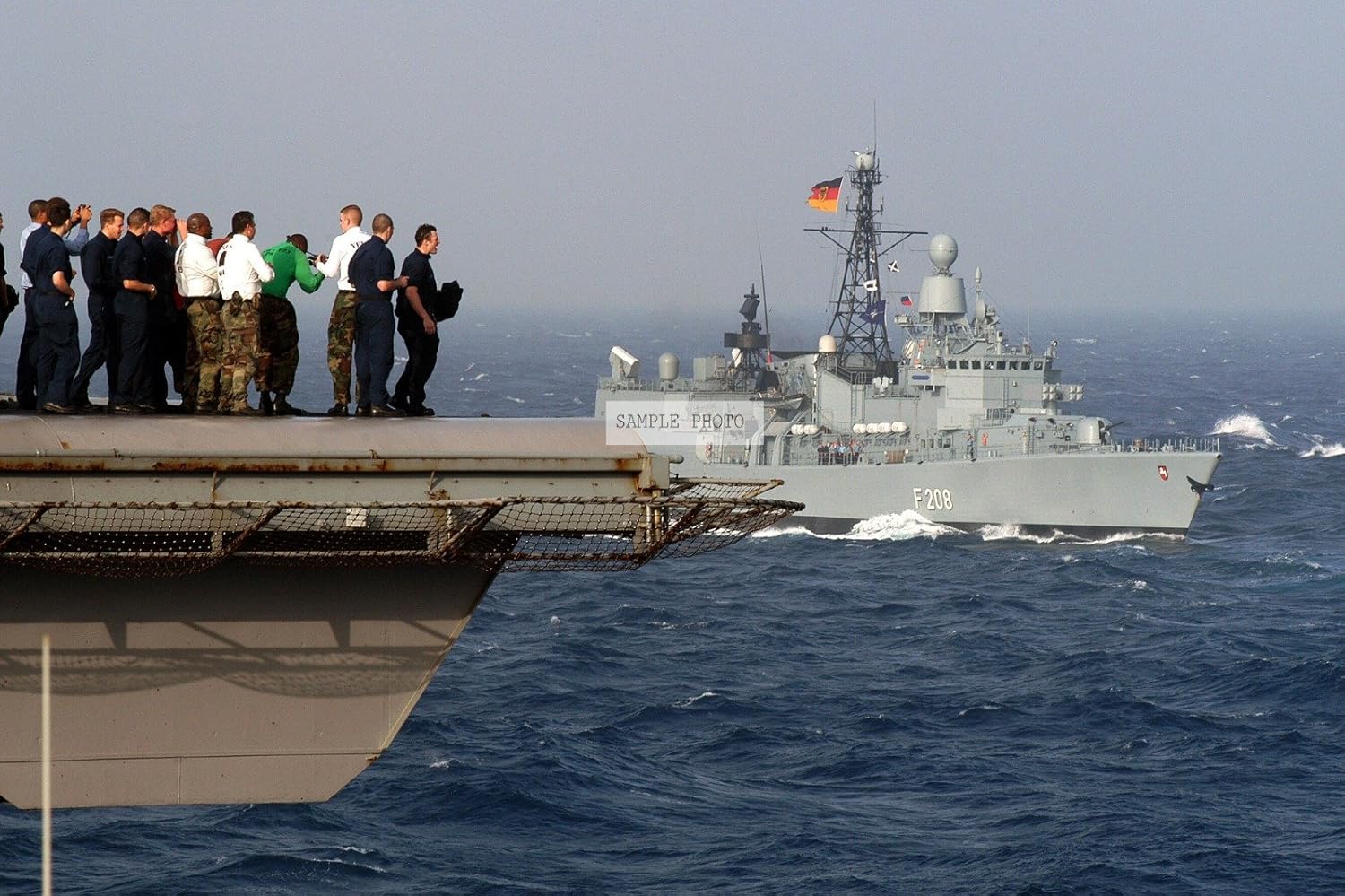 Photo US Navy (USN) Sailors gather on the flight deck of