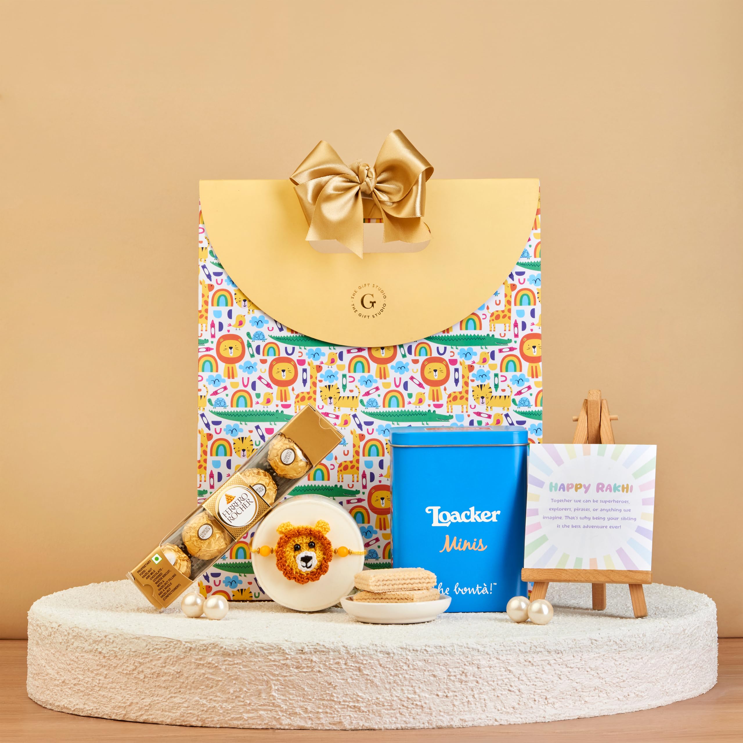 THE GIFT STUDIO.COM | The Safari Kids Rakhi Hamper | Crochet Lion Kids Rakhi, Ferrero Rocher, Loacker Minis & Gift Bag | Raksha Bandhan Gift-image-11