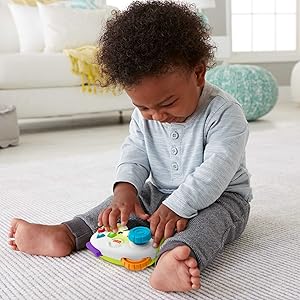 Fisher-Price FWG13 Musical Gamepad and Learning Joystick - Bright Musical Interactive Baby Toy with Learning and Play Modes, 6 Months and Above Fisher-Price FWG13 Musical Gamepad and Learning Joystick - Bright Musical Interactive Baby Toy with Learning and Play Modes, 6 Months and Above