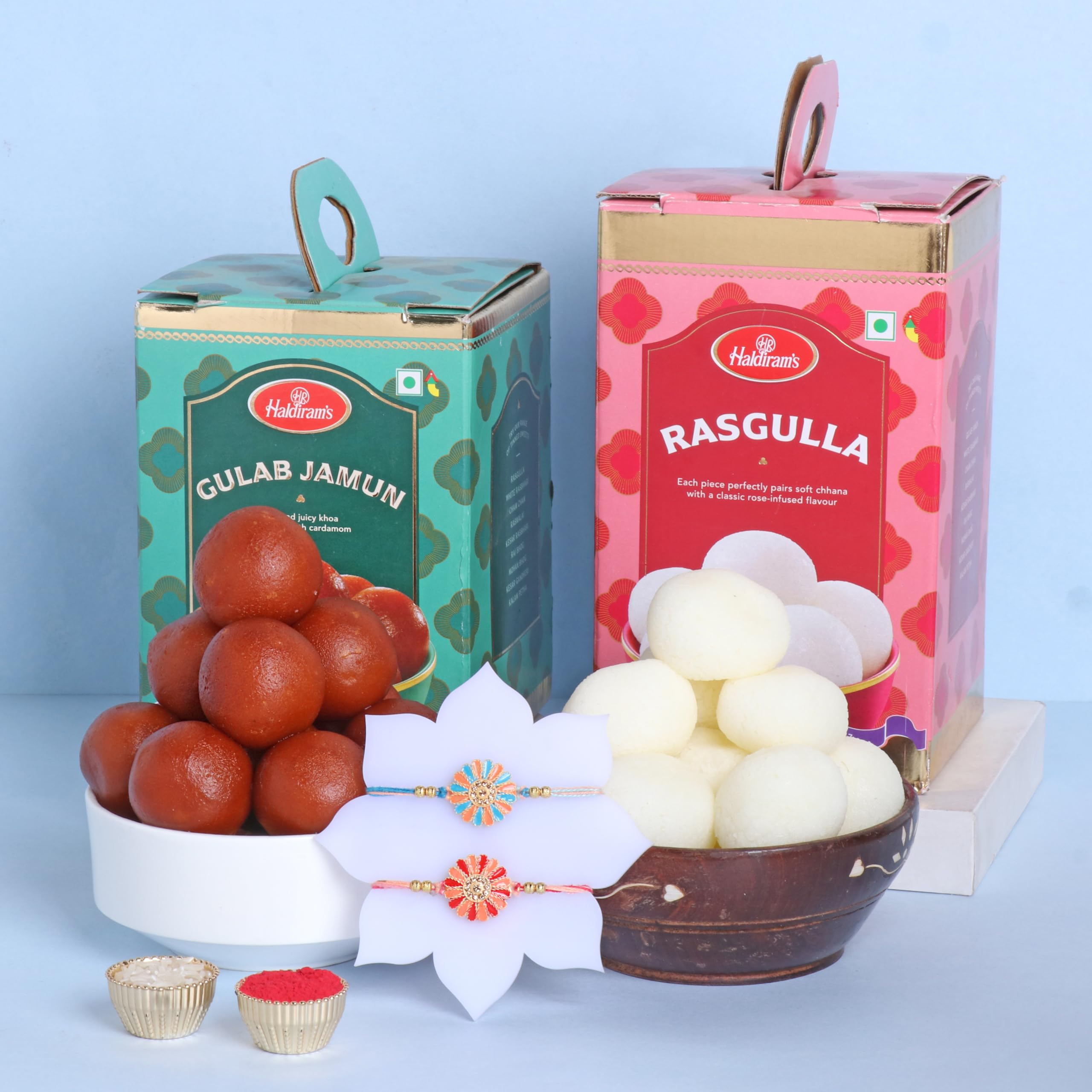 FlowerAura Raksha Bandhan Celebrations Flower Shaped Set Of 2 Rakhis With 1Kg Rasgulla & 1Kg Gulab Jamun - Rakhi for Brother, Bhai, Cousins & Raksha Bandhan Gift (Same Day Delivery) (B0D9BGDW4B) Amazon Price History, Amazon Price Tracker