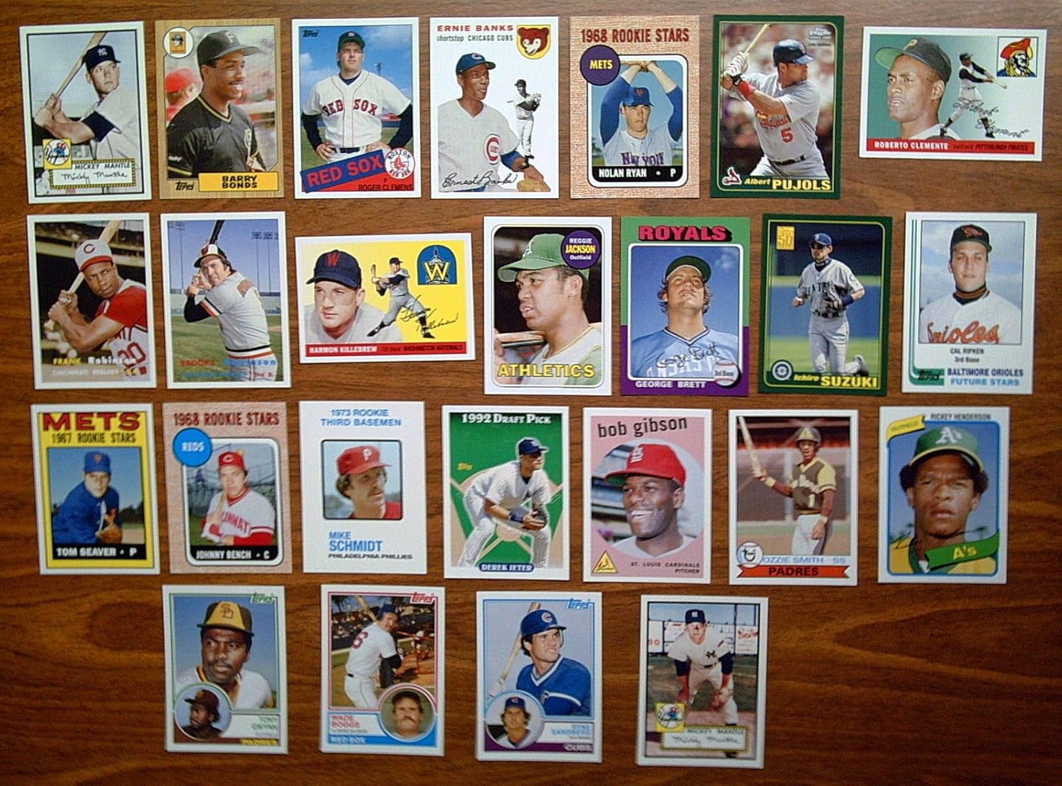 2006 Topps Baseball Rookie of the Week Baseball Complete 25 Card Set - Loaded with HOFers - Great reprint Rookie Cards including 2 x 1952 Mickey Mantle, 1993 Derek Jeter, 1955 Roberto Clemente, 1967 Tom Seaver, 1982 Cal Ripken, 1968 Johnny Bench, 1968 Nolan Ryan, 1969 Reggie Jackson, 1979 Ozzie Smith, 1980 Rickey Henderson, 1973 Mike Schmidt, 1975 Brett, 2001 Ichiro, 2001 Pujols, 1983 Gwym, 1959 Bob Gibson, 1983 Sandberg, 1983 Boggs, 1954 Ernie Banks, 1985 Roger Clemens, 1987 Barry Bonds, 1954 Harmon Killebrew, 1957 Brooks Robinson, 1957 Frank Robinson - shipped in an acrylic case