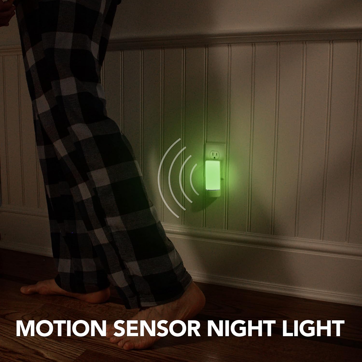A person's legs walking past a wall-plugged night light that is emitting a green glow, with motion sensor waves depicted.