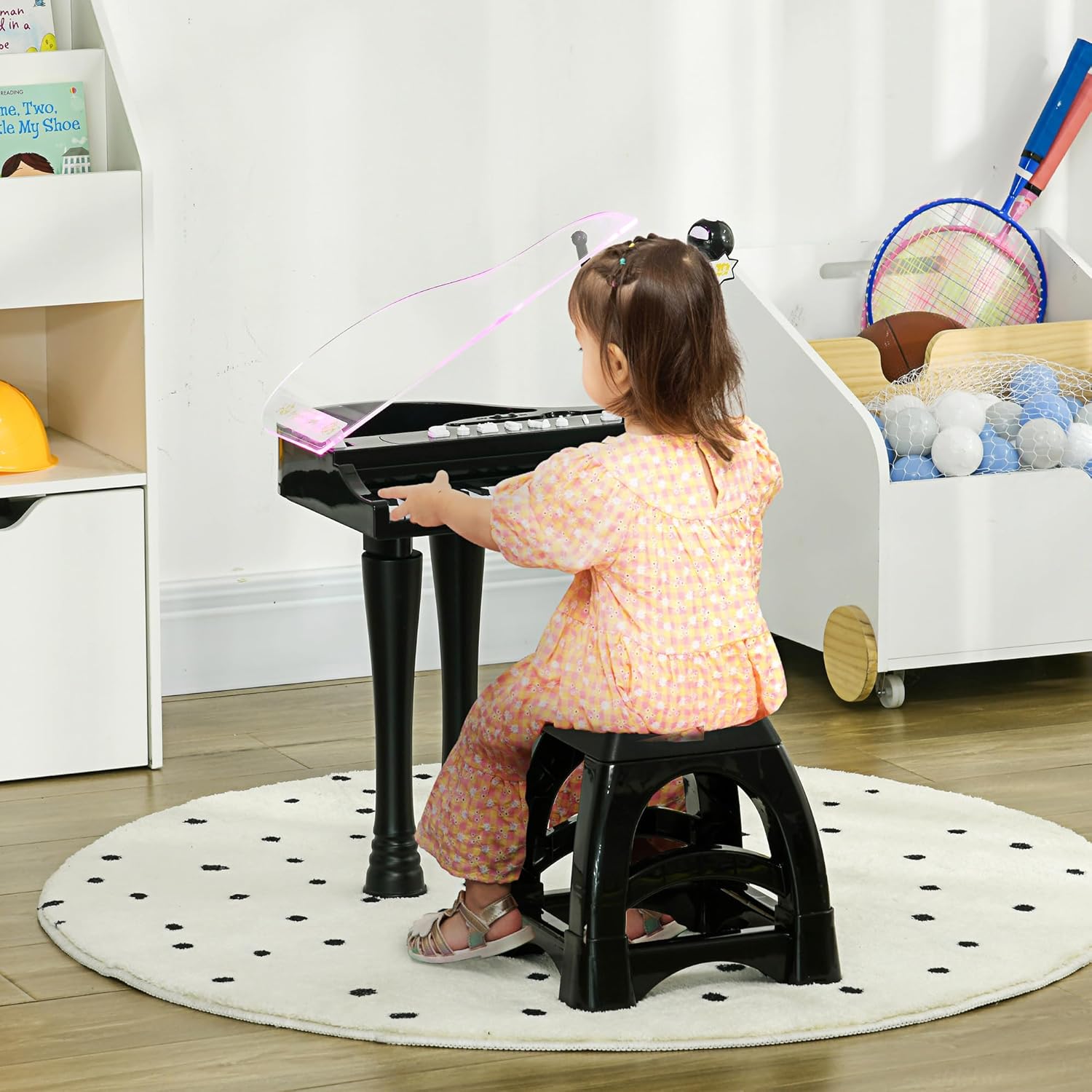 Child playing the AIYAPLAY electronic piano with stool