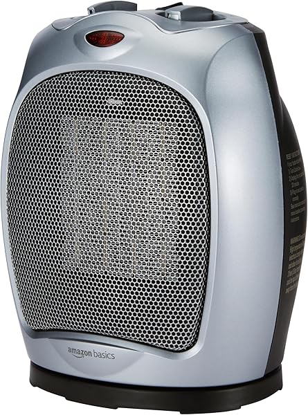 Close-up of the Amazon Basics oscillating ceramic space heater, showing its compact design and silver finish.