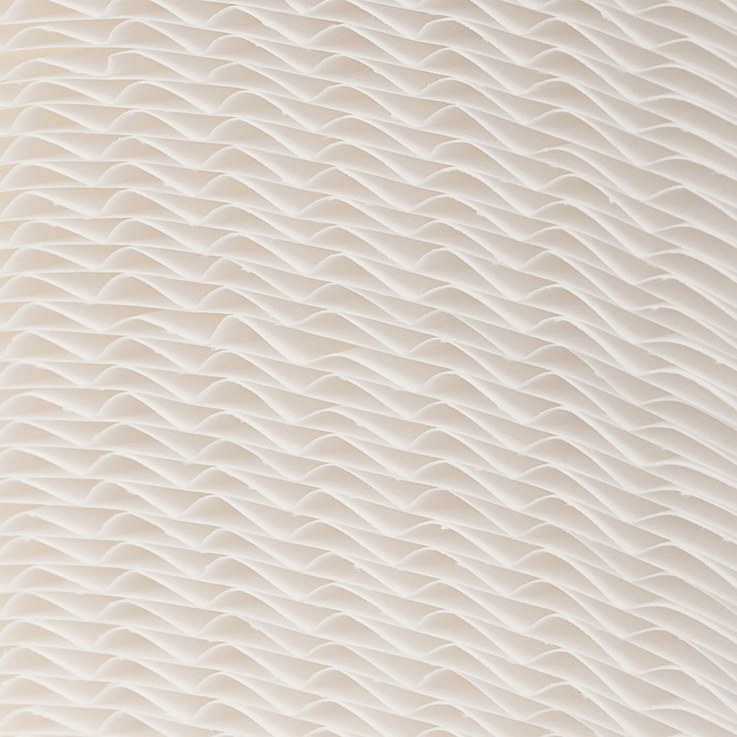 Close-up view of the pleated wicking material of an AIRCARE humidifier filter
