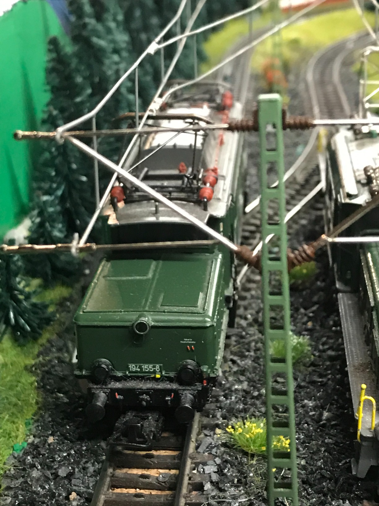 Märklin 74121 Catenary Feeder Mast installed on a model railway layout