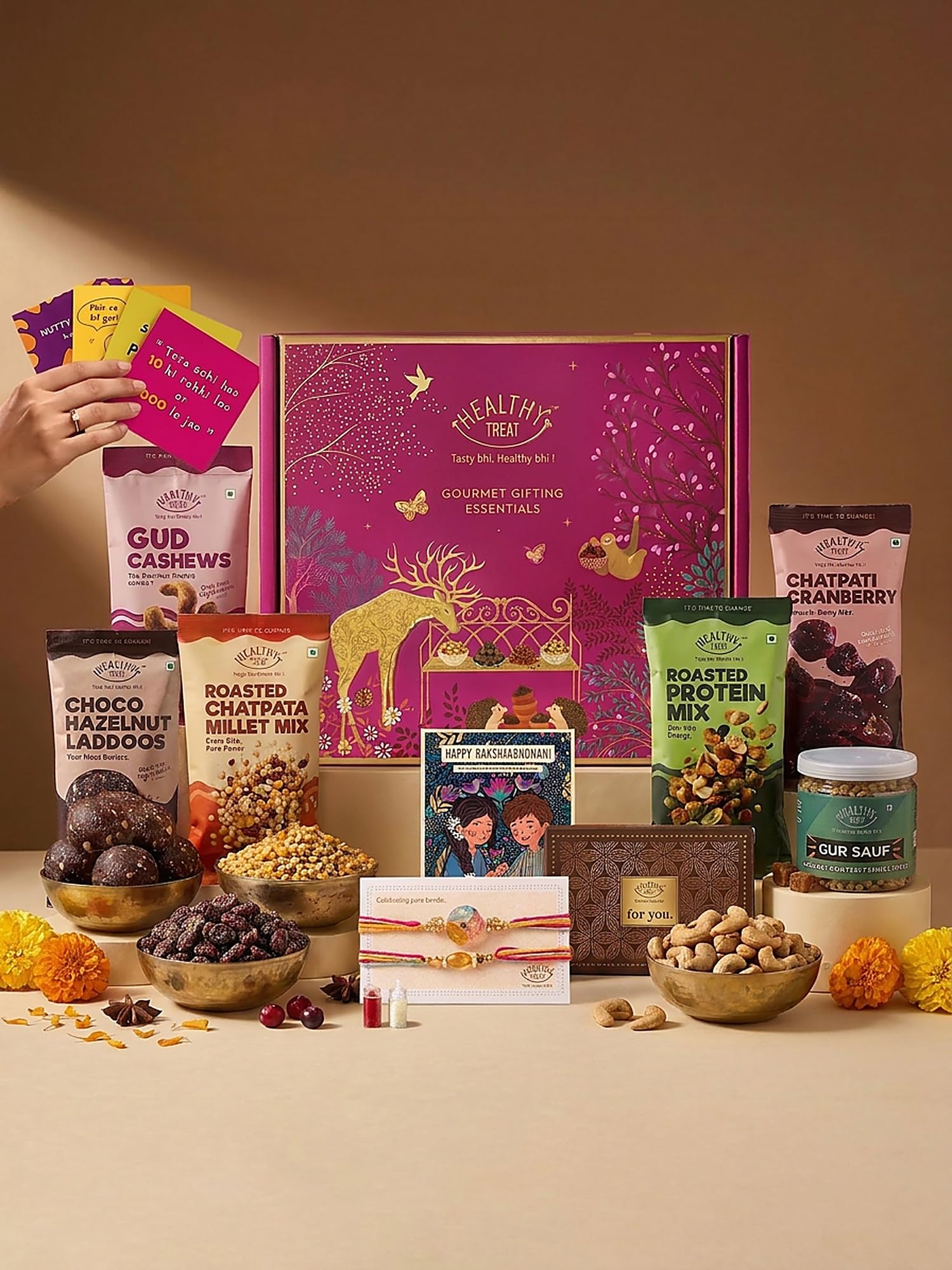 Healthy Treat Bandhan Rakhi Gift Hamper | Premium Raksha Bandhan Gift Box with 2 Handcrafted Rakhis, Choco Hazelnut Laddoos, Roasted Protein Mix, Chatpata Millet Mix, Gur Saunf, Roli Chawal, Greeting Card & Rakhi Stickers | Healthy Festive Gift