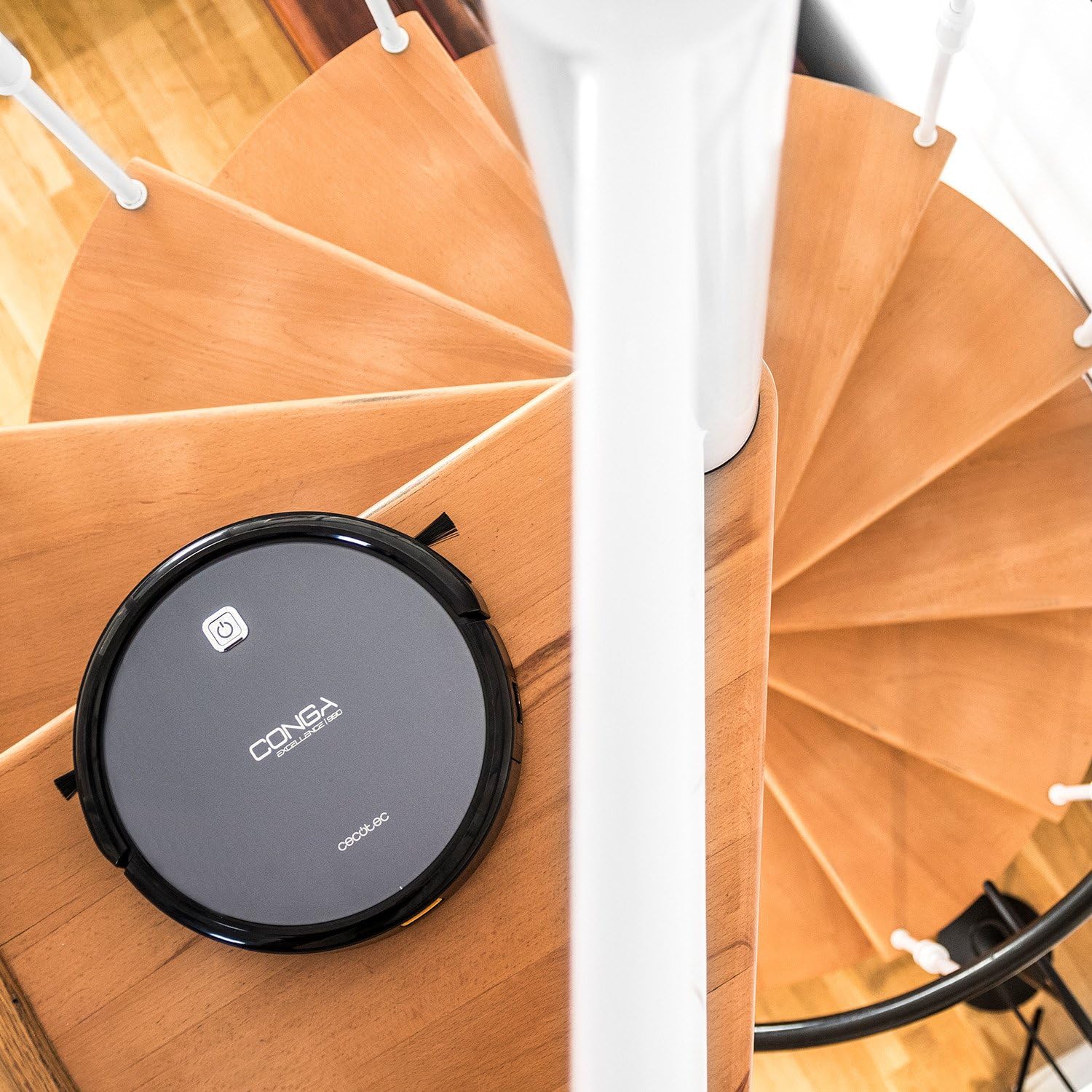 Conga Excellence 990 Robot Vacuum Cleaner near a spiral staircase
