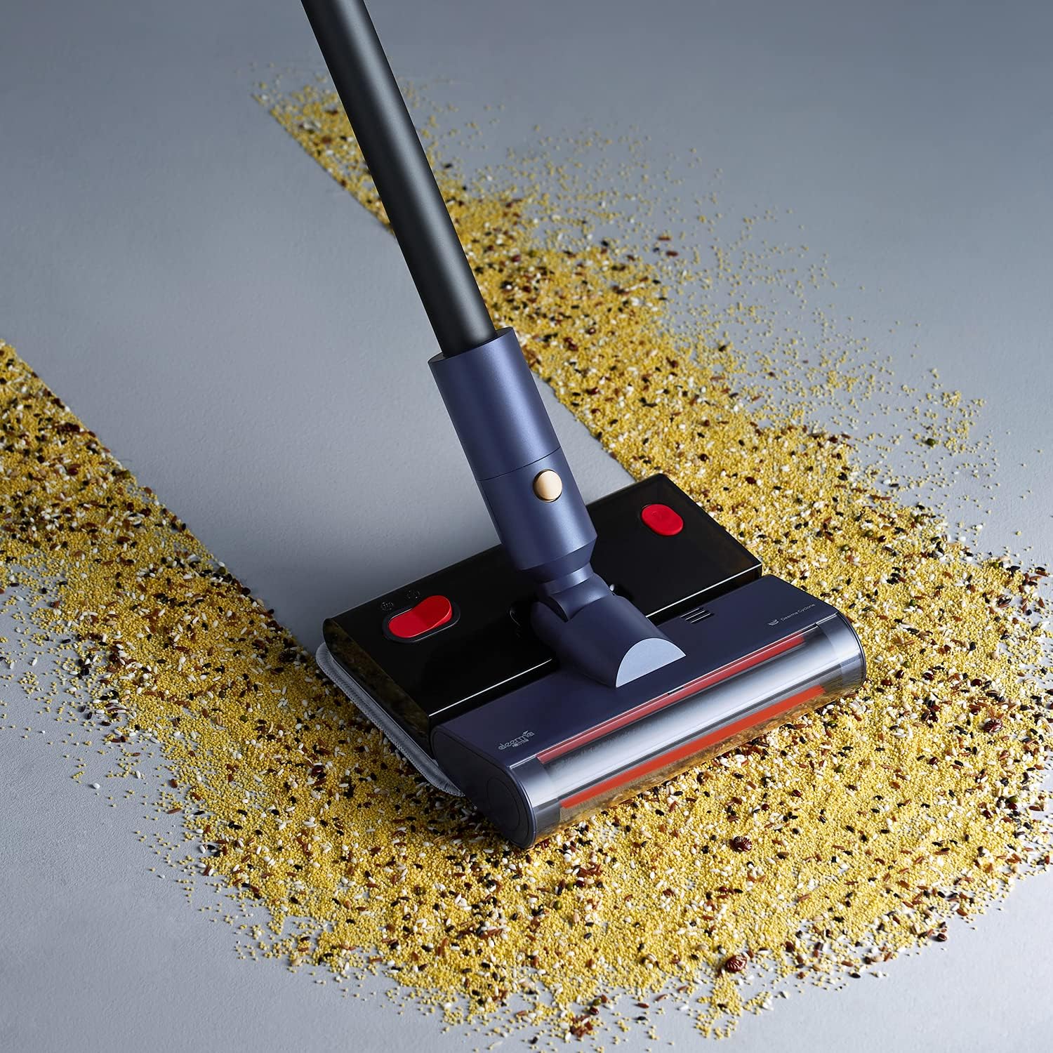 Deerma VC20 Pro vacuuming spilled grains on a floor