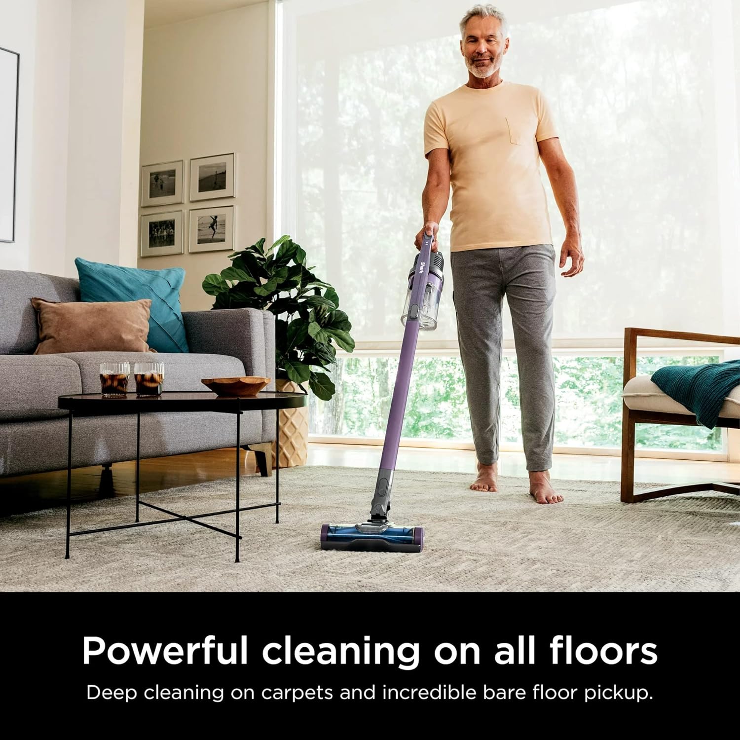 Man vacuuming carpet with Shark WZ240