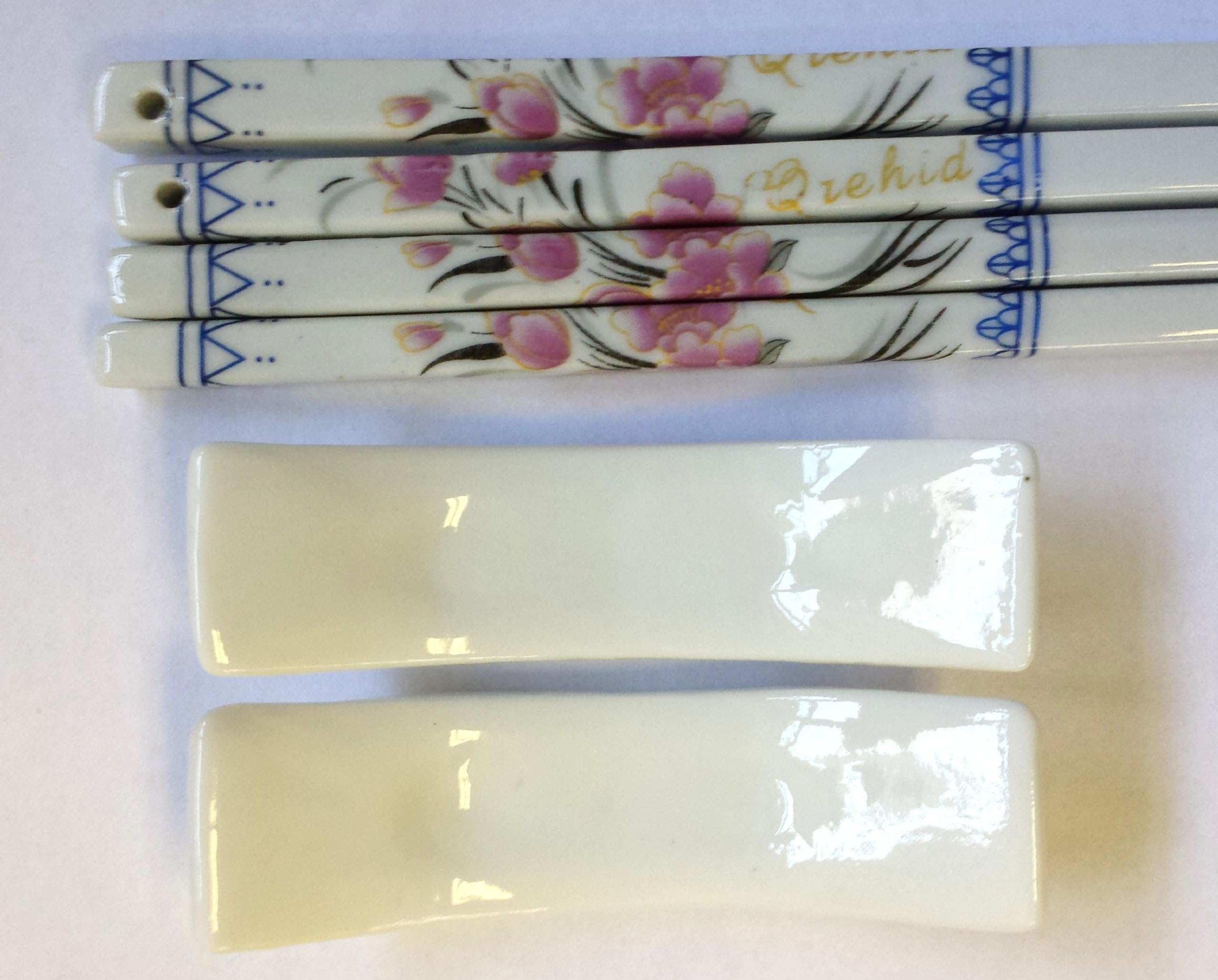 Set of Porcelain Chopsticks with White Rest Decorated with Small Pink Floral Design Service for 2