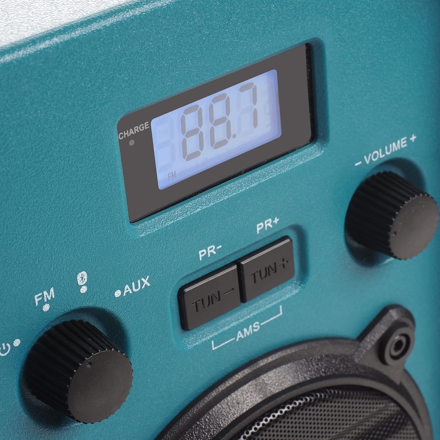 Close-up of the control panel, showing the digital display, FM/AUX/Bluetooth selection, tuning buttons, and volume knob.