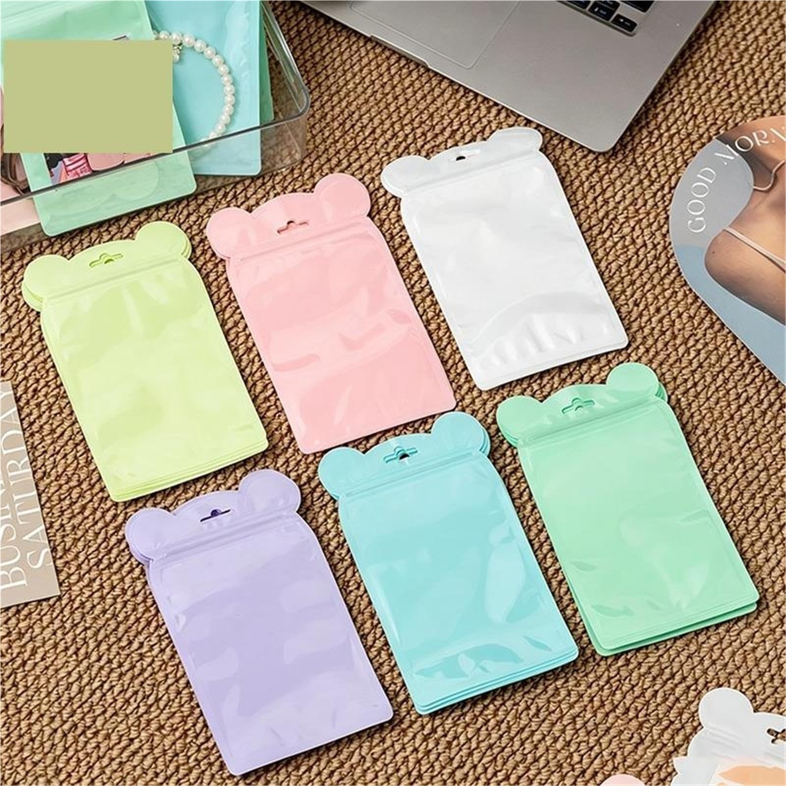 100 bolsas de plástico multicolores autoselladas.